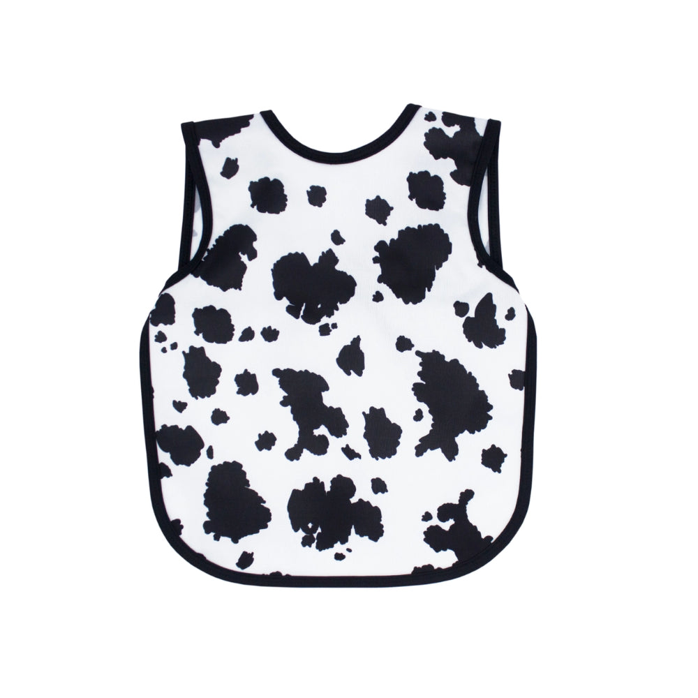Black and white cow print baby bib-apron on a white background