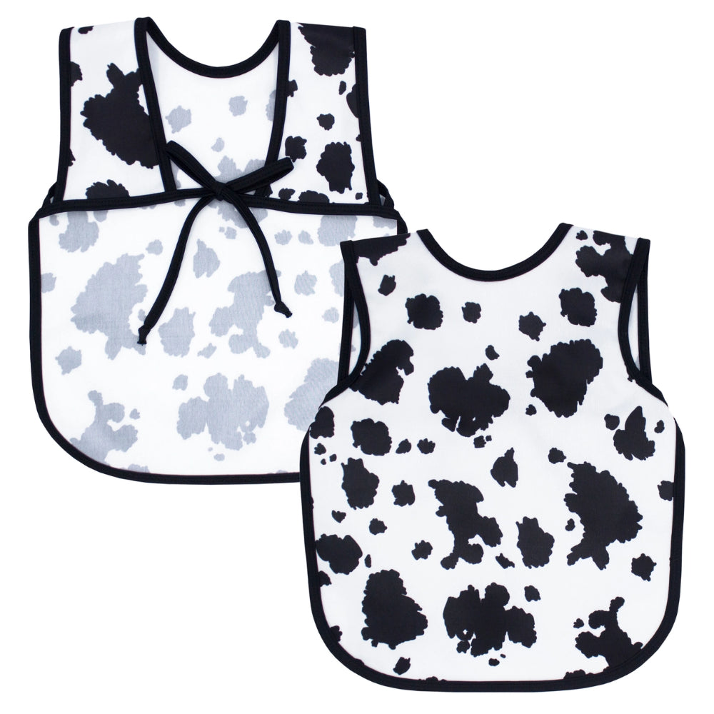 Two cow print bibs on a white background