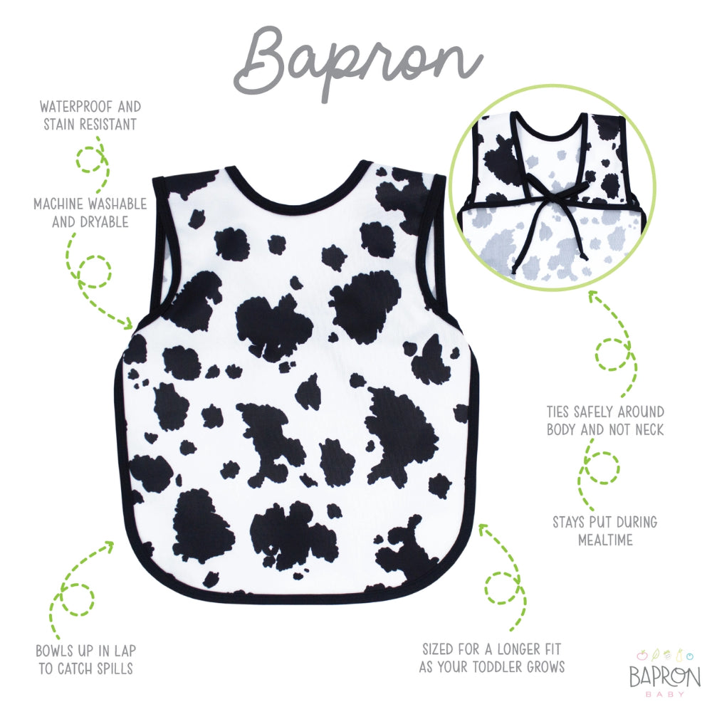 Cow print bib with features listed on a white background