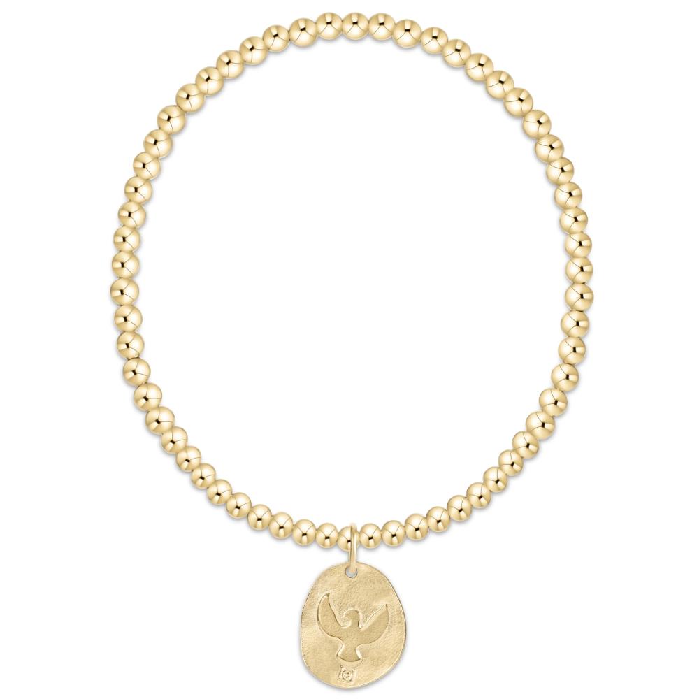 Gold beaded bracelet with a gold dove pendant on a white background