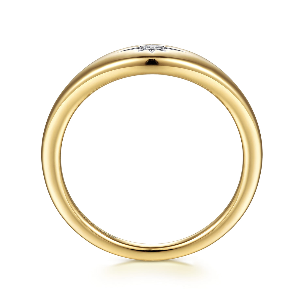 Gold ring with a small diamond on a white background