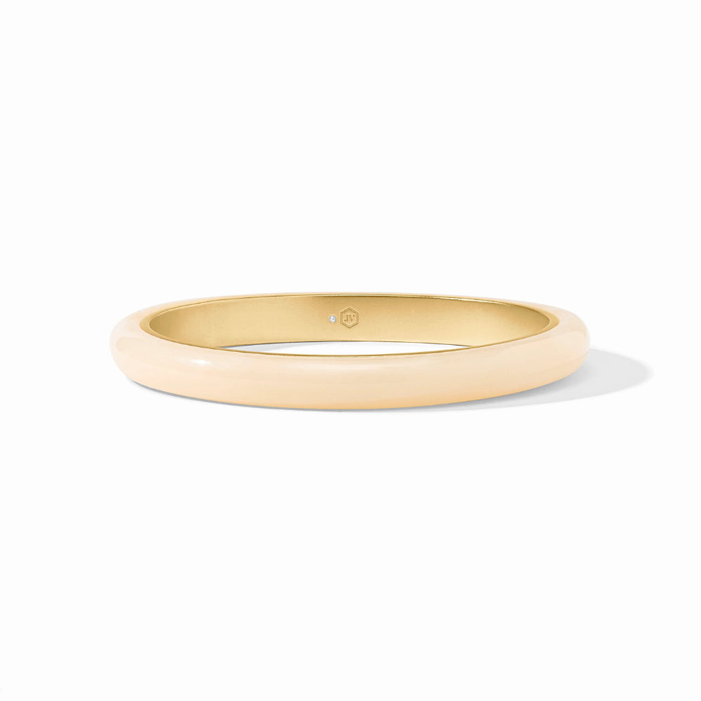Gold bangle on a white background