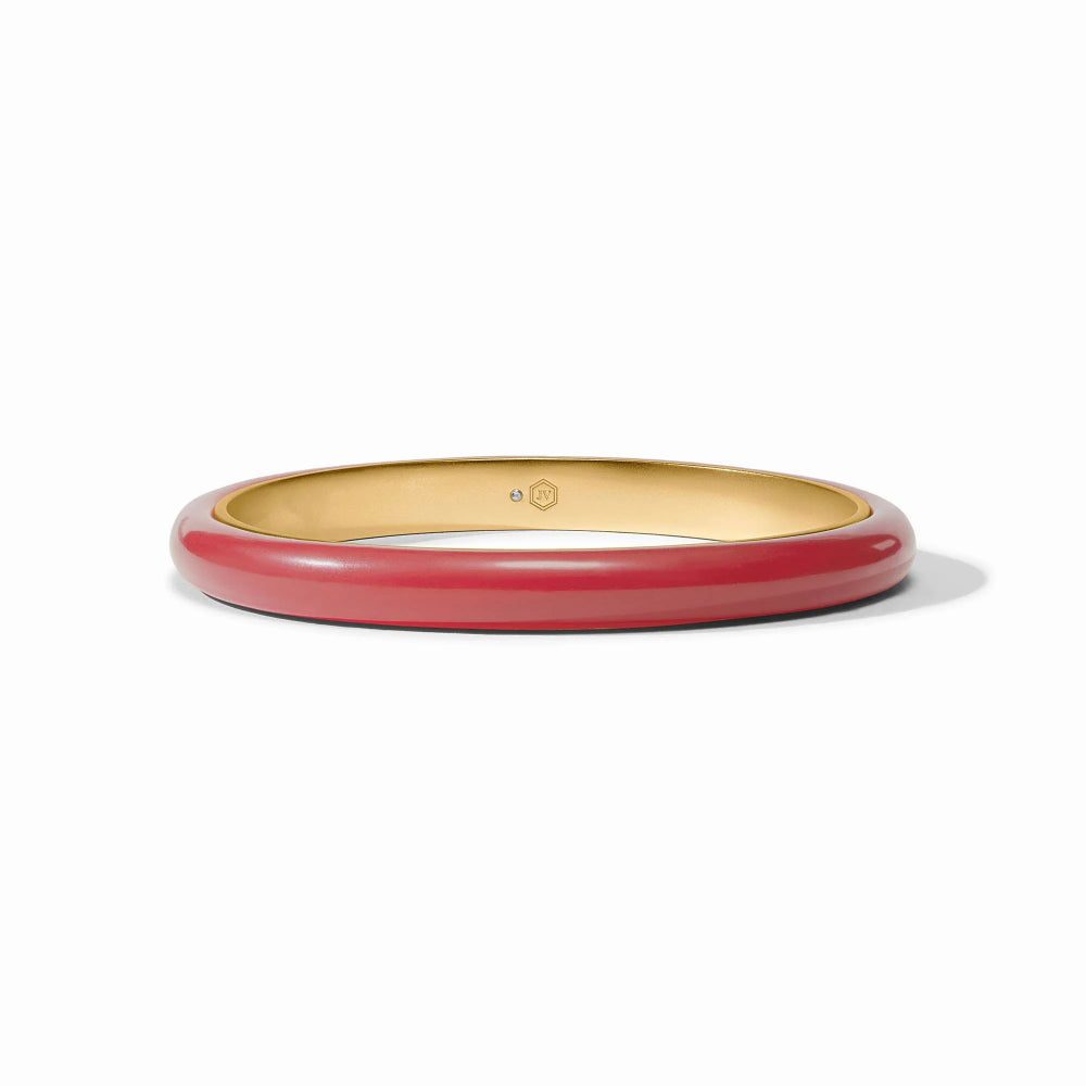 Gold and red bangle on a white background