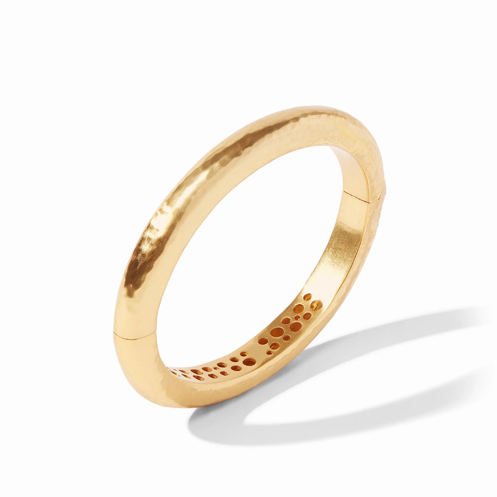 Gold bangle bracelet on a white background