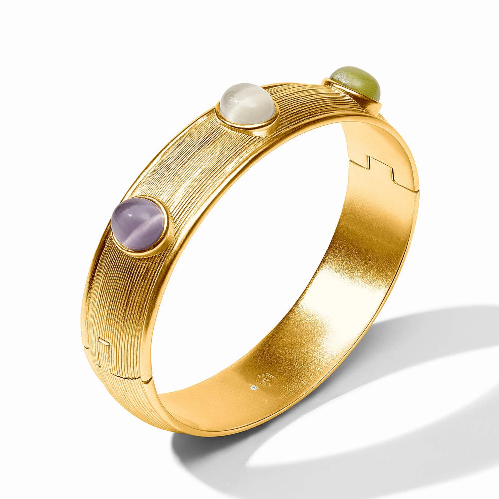 Gold bracelet with gemstones on a white background