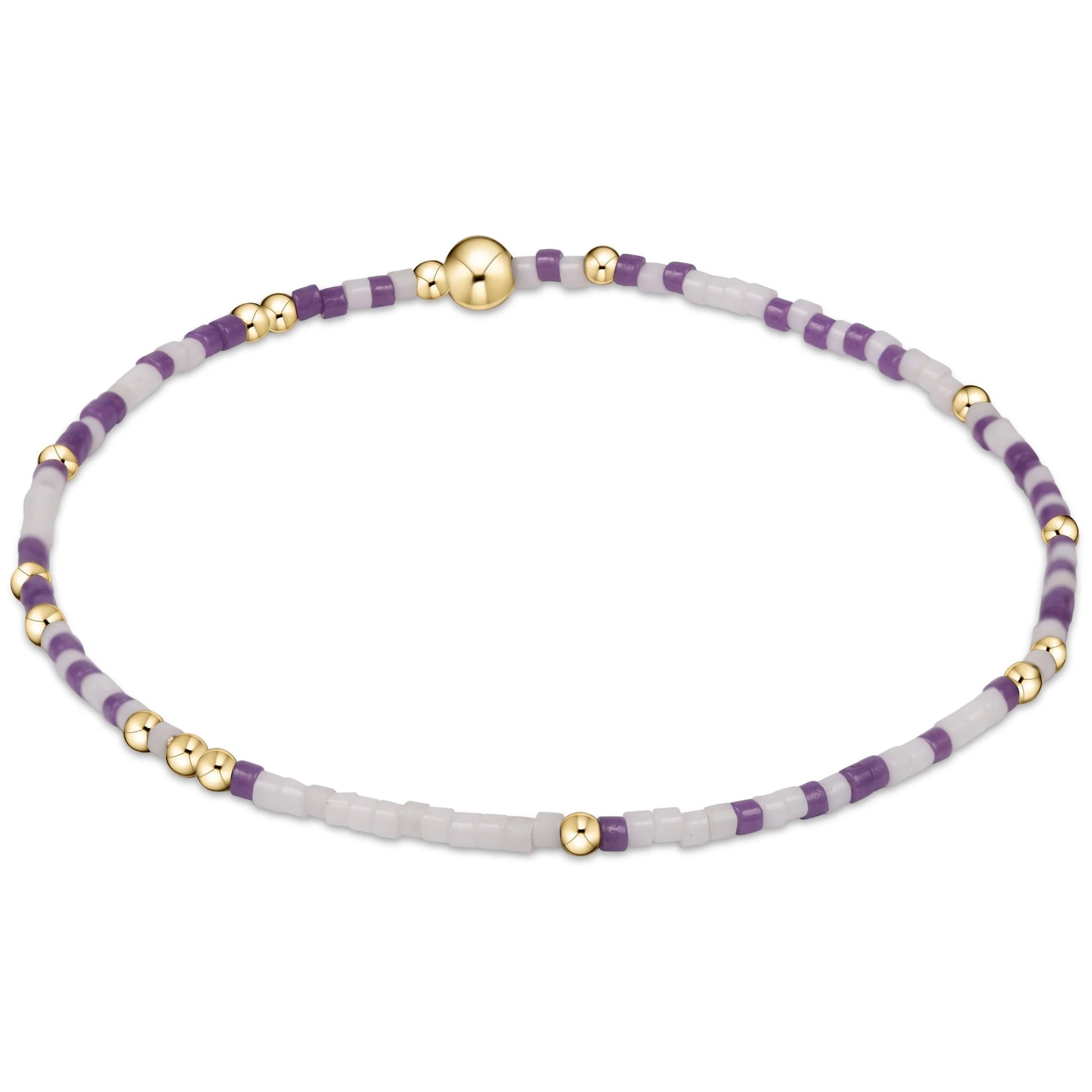 Bracelet with purple, white and gold beads on a white background