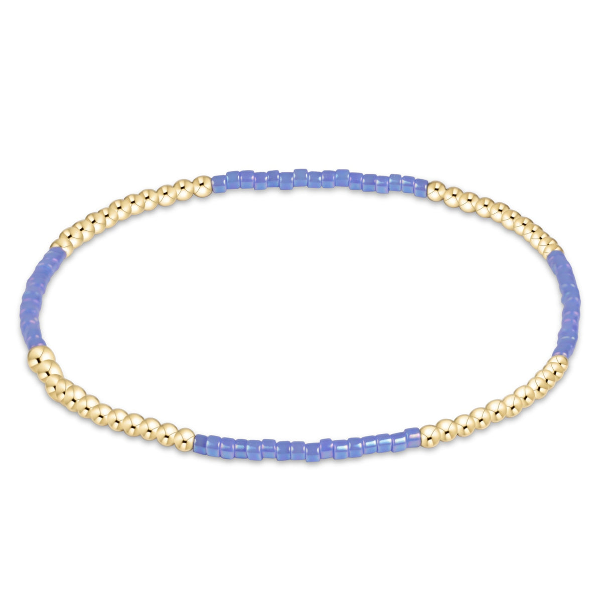 A delicate beaded stretch bracelet featuring alternating sections of light blue beads and textured gold-toned beads, displayed on a clean white background.