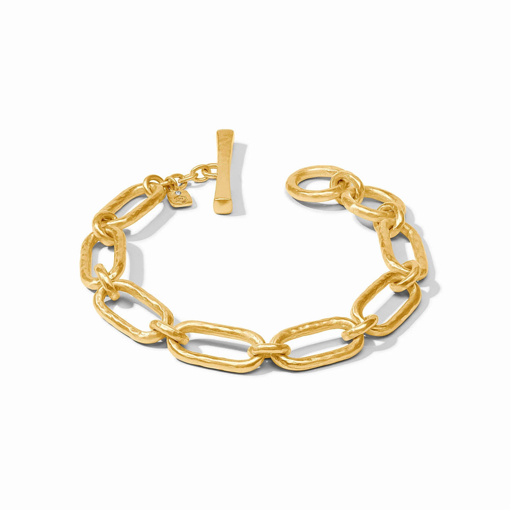 A gold paperclip chain bracelet with a toggle clasp, displayed on a clean white background.