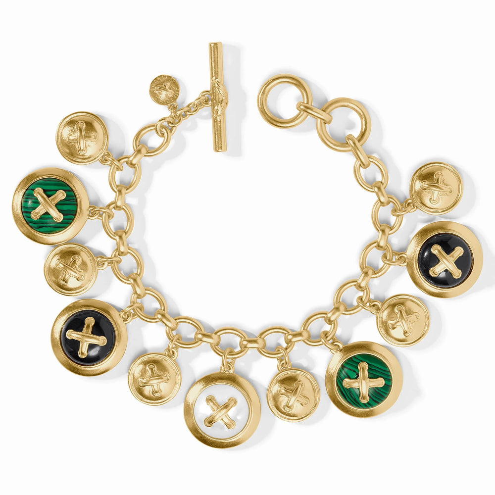 Gold charm bracelet with various charms on a white background