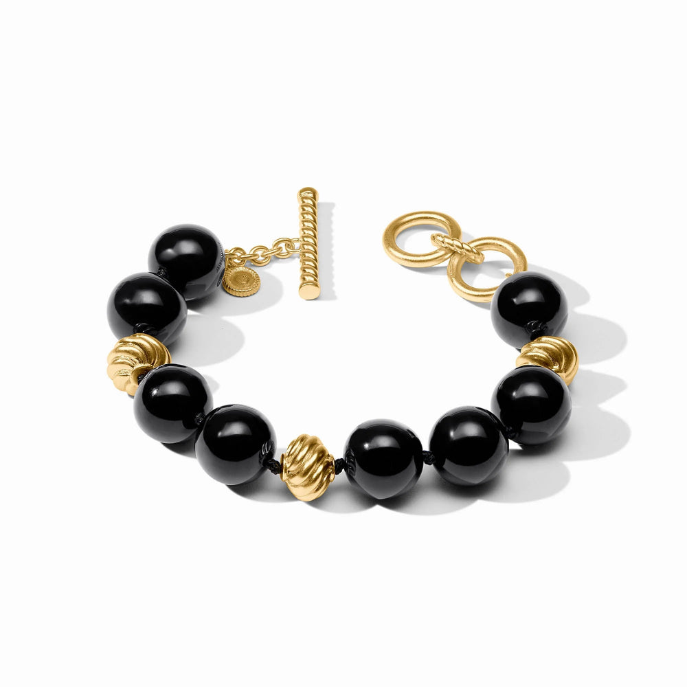 Black beaded bracelet with gold accents on a white background
