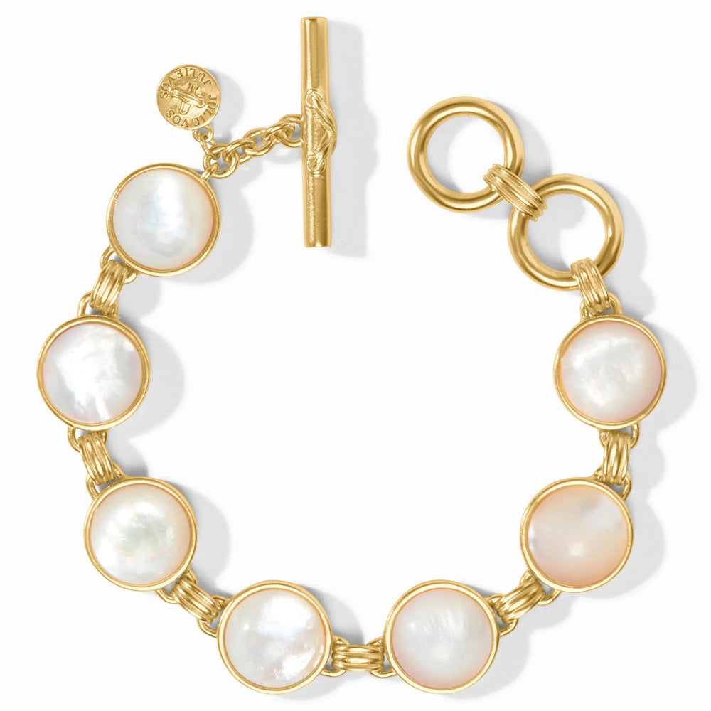 Gold bracelet with pearl-like beads on a white background