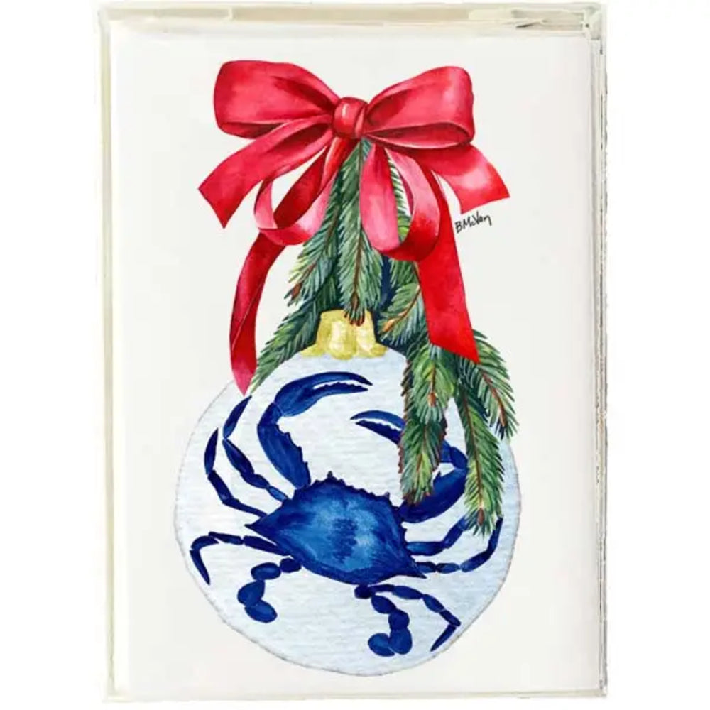 A square art print or card featuring a watercolor illustration of a blue crab inside a white ornament, hanging from green pine branches tied with a large red bow, shown against a white background.