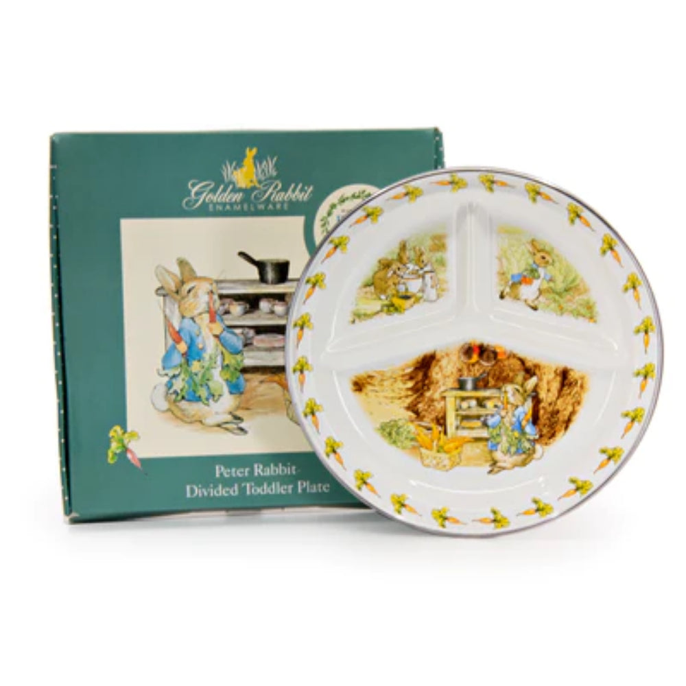 A white divided enameled steel toddler plate with 'Peter Rabbit' illustration and  packaging on a white background.
