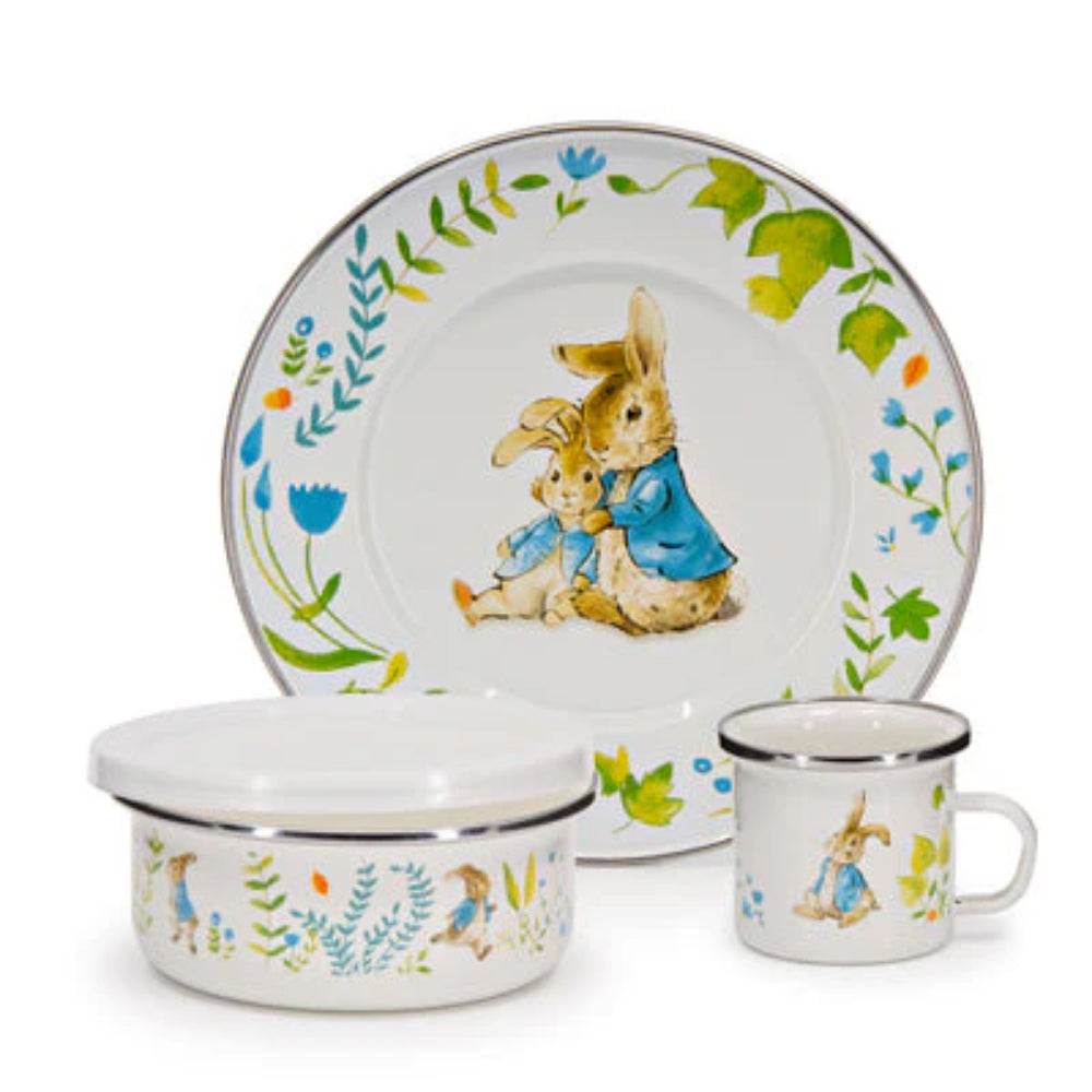 Children's ceramic tableware set with rabbit illustrations on a white background.