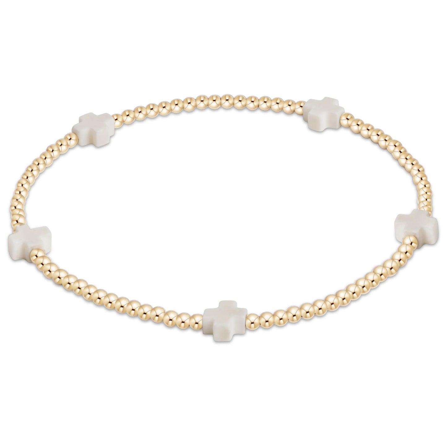 Gold bracelet with white cross beads on a white background