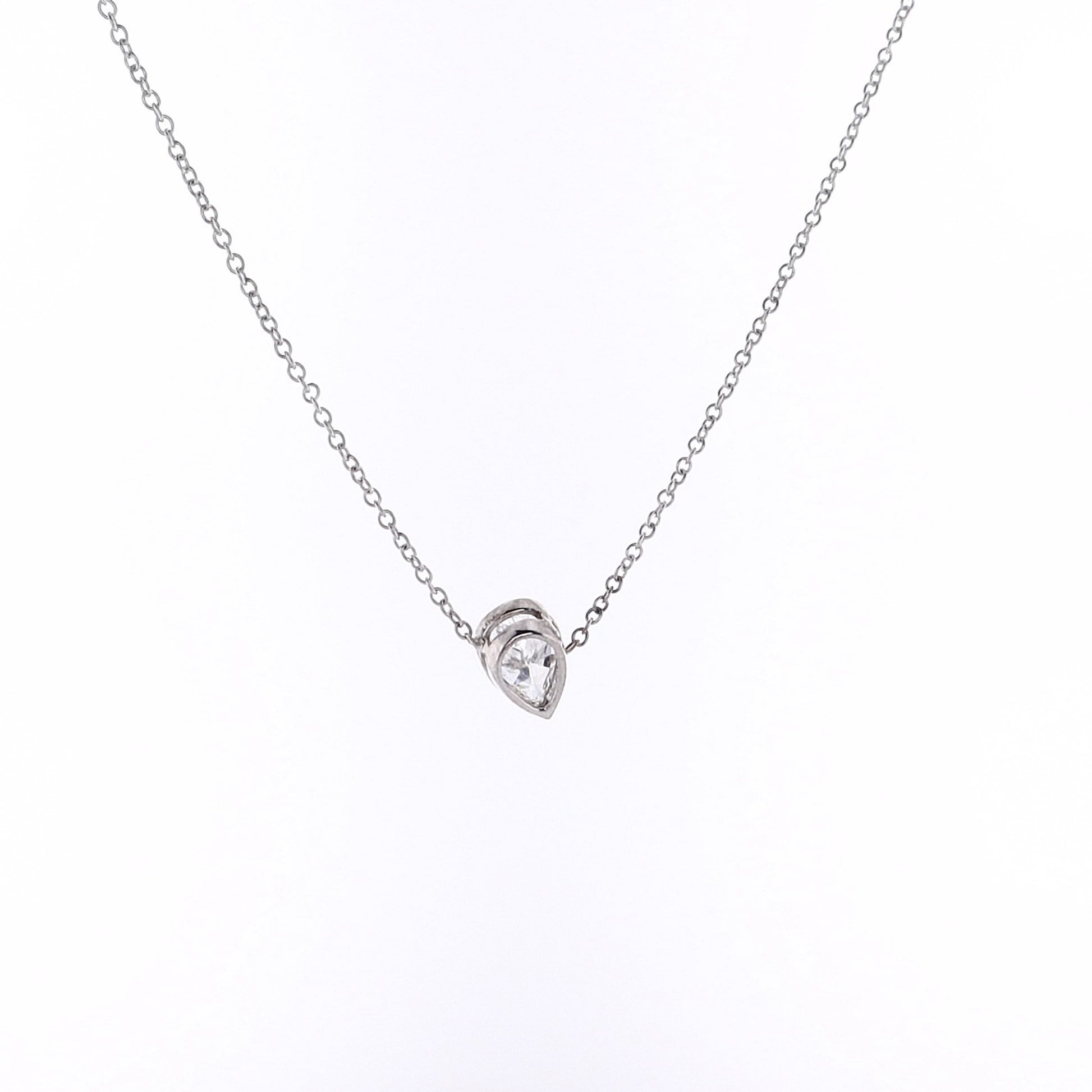 Pear shape diamond pendant necklace on a white background