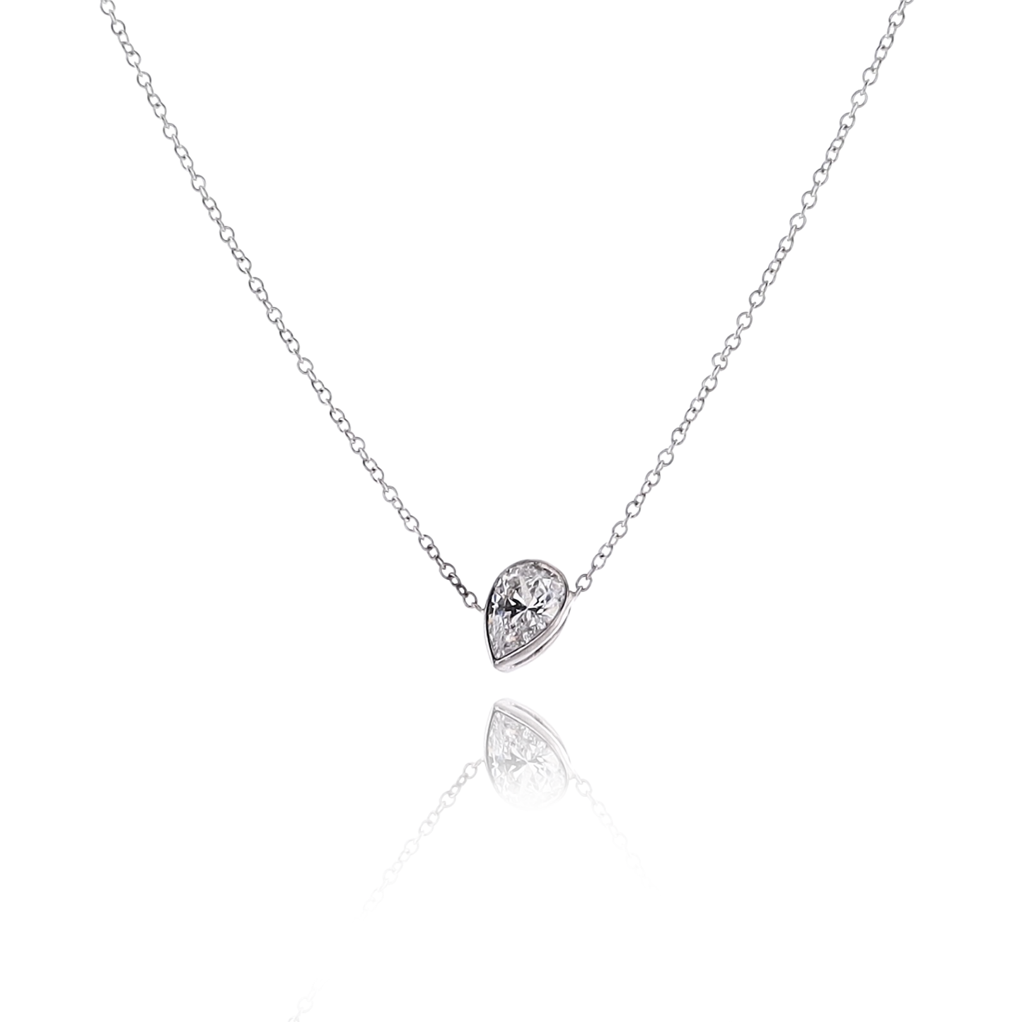 Pear shape diamond pendant necklace on a white background