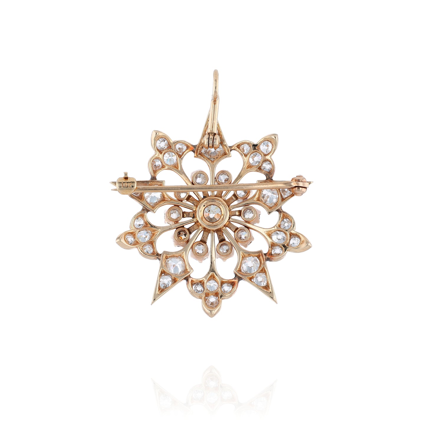 Yellow gold modular pin or pendant with diamond accents on a white background