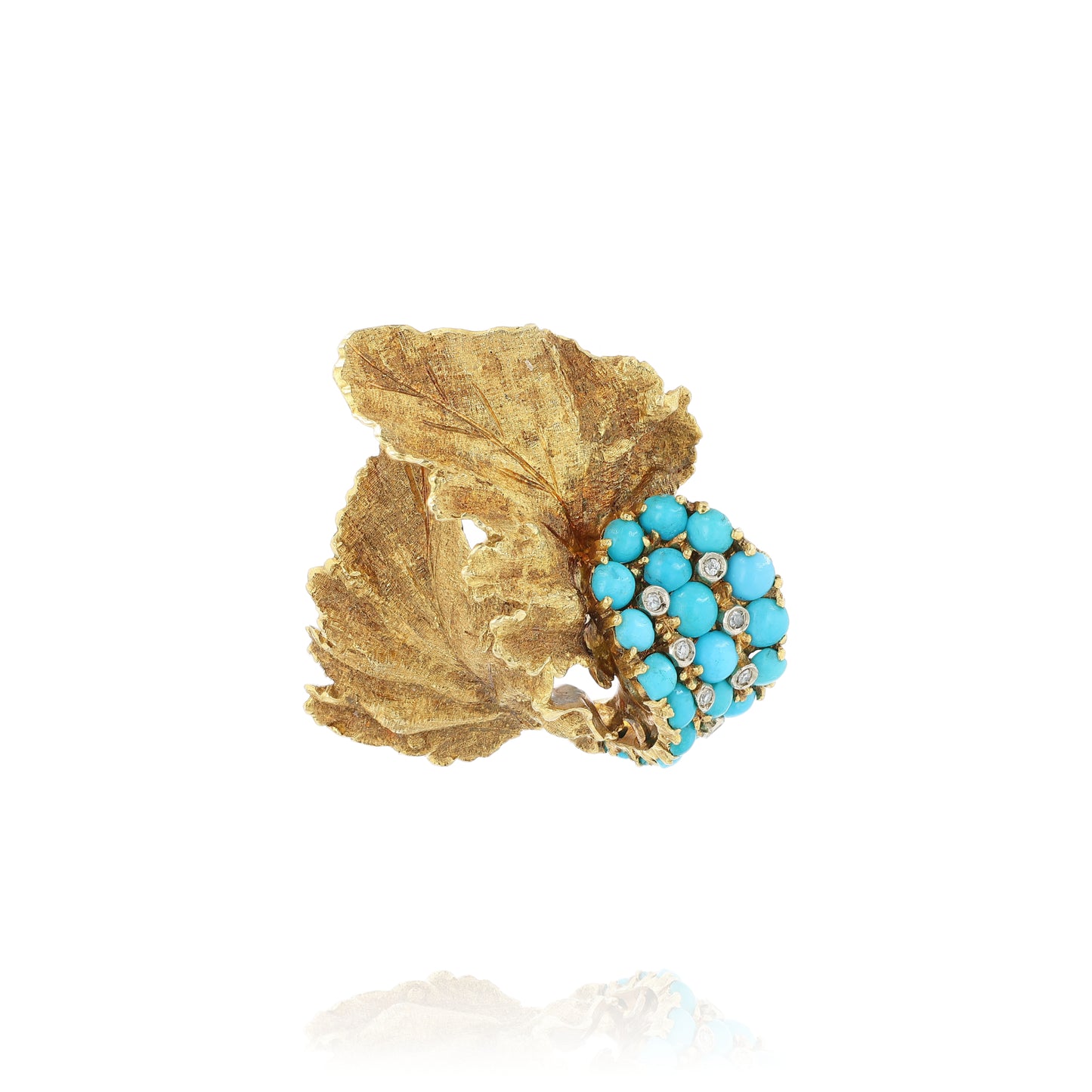 Yellow gold brushed leaf design turquoise and diamond pin on a white background