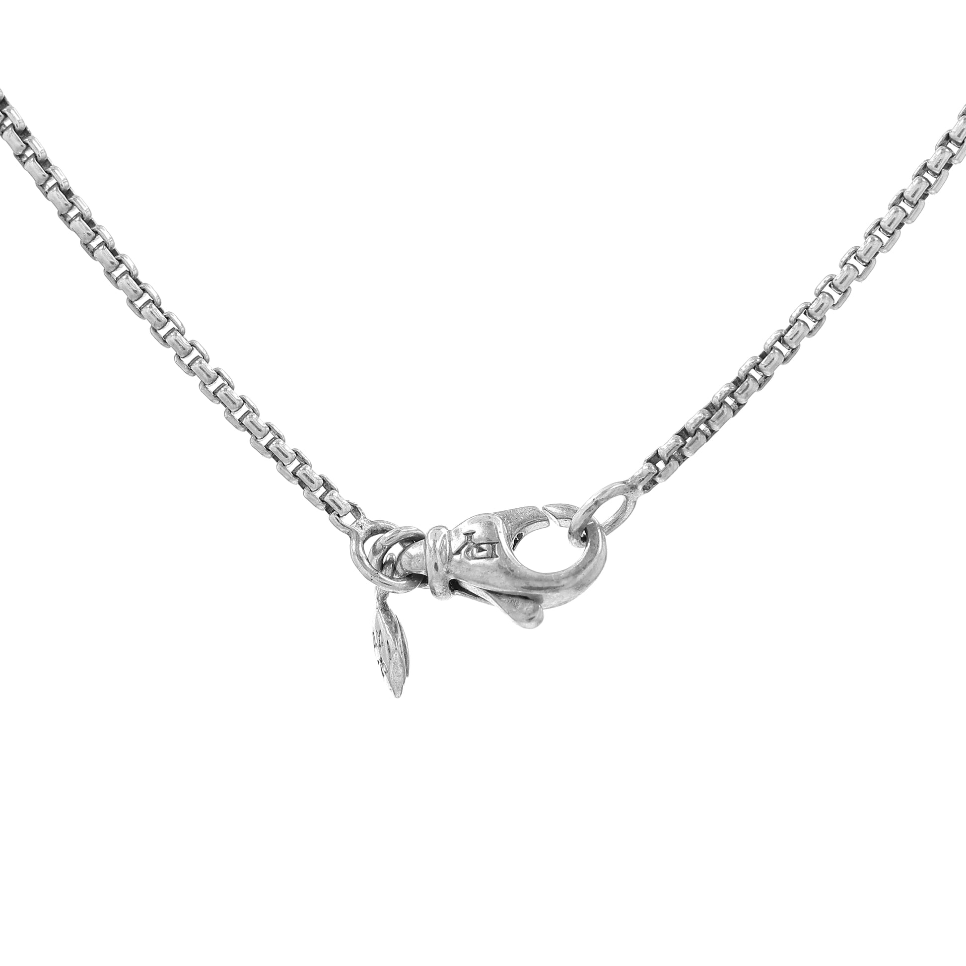 David Yurman silver pendant necklace with a faceted black onyx center and a pave diamond bail on a white background