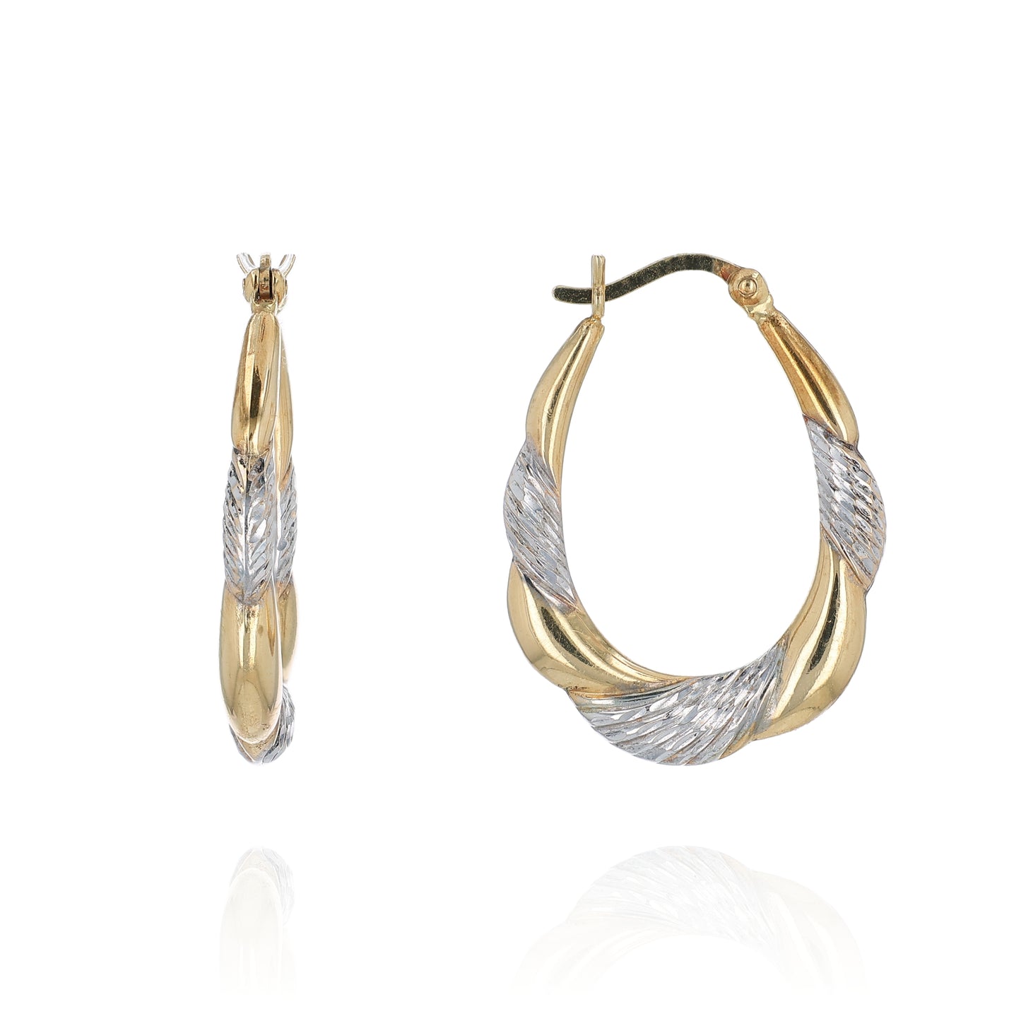 Two-tone gold and silver hoop earrings on a white background