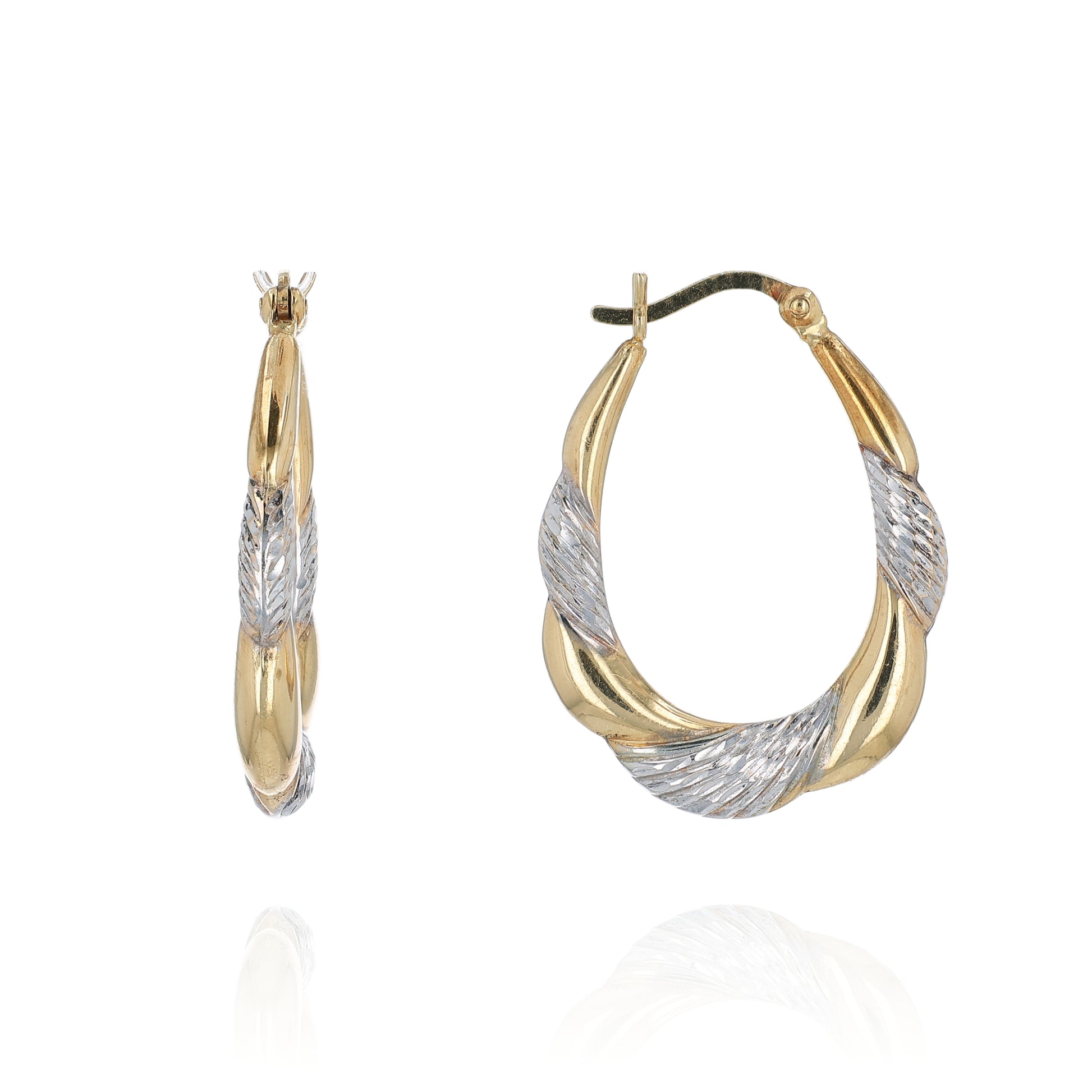 Two-tone gold and silver hoop earrings on a white background