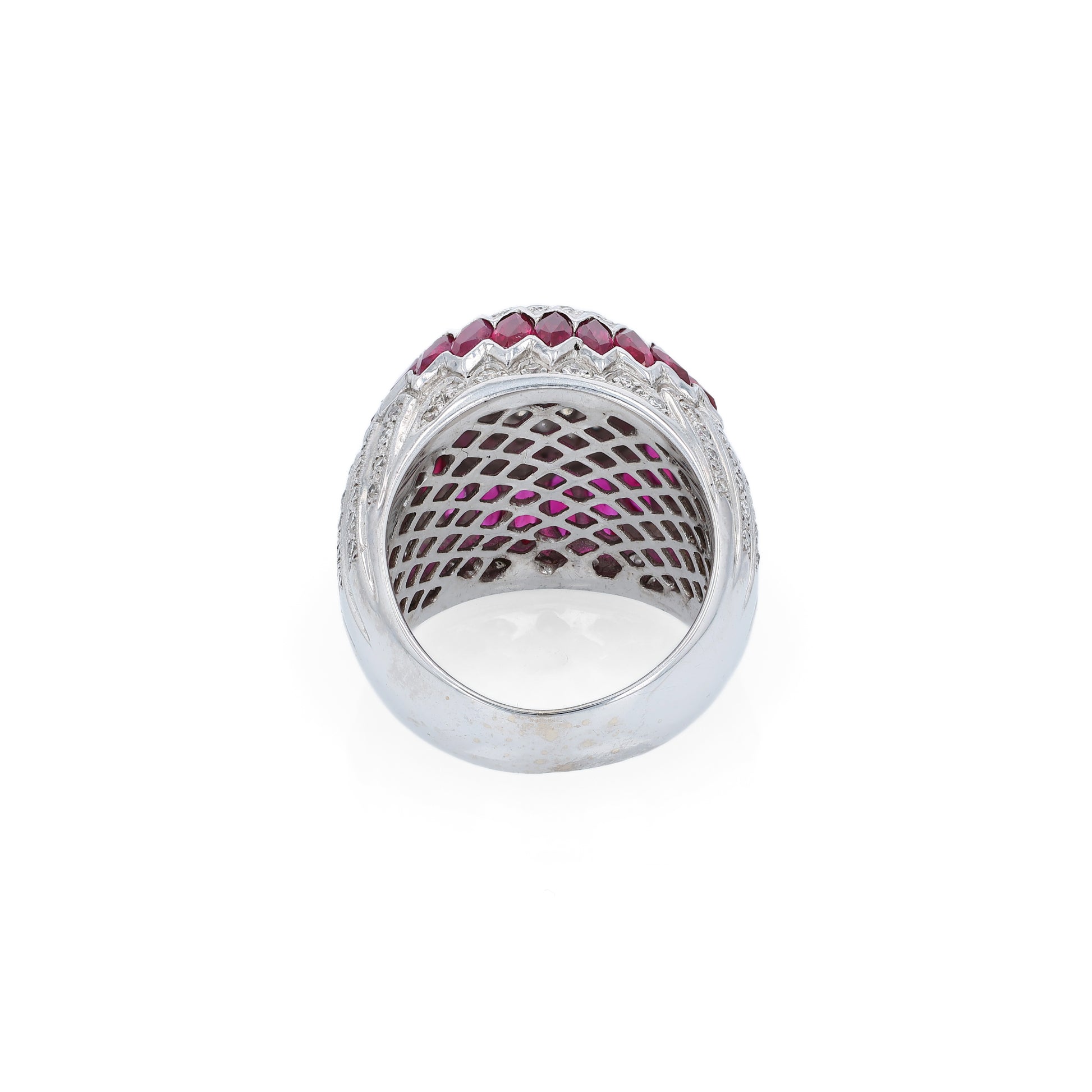 Elegant white gold ring with marquise rubies and diamond accents on a white background