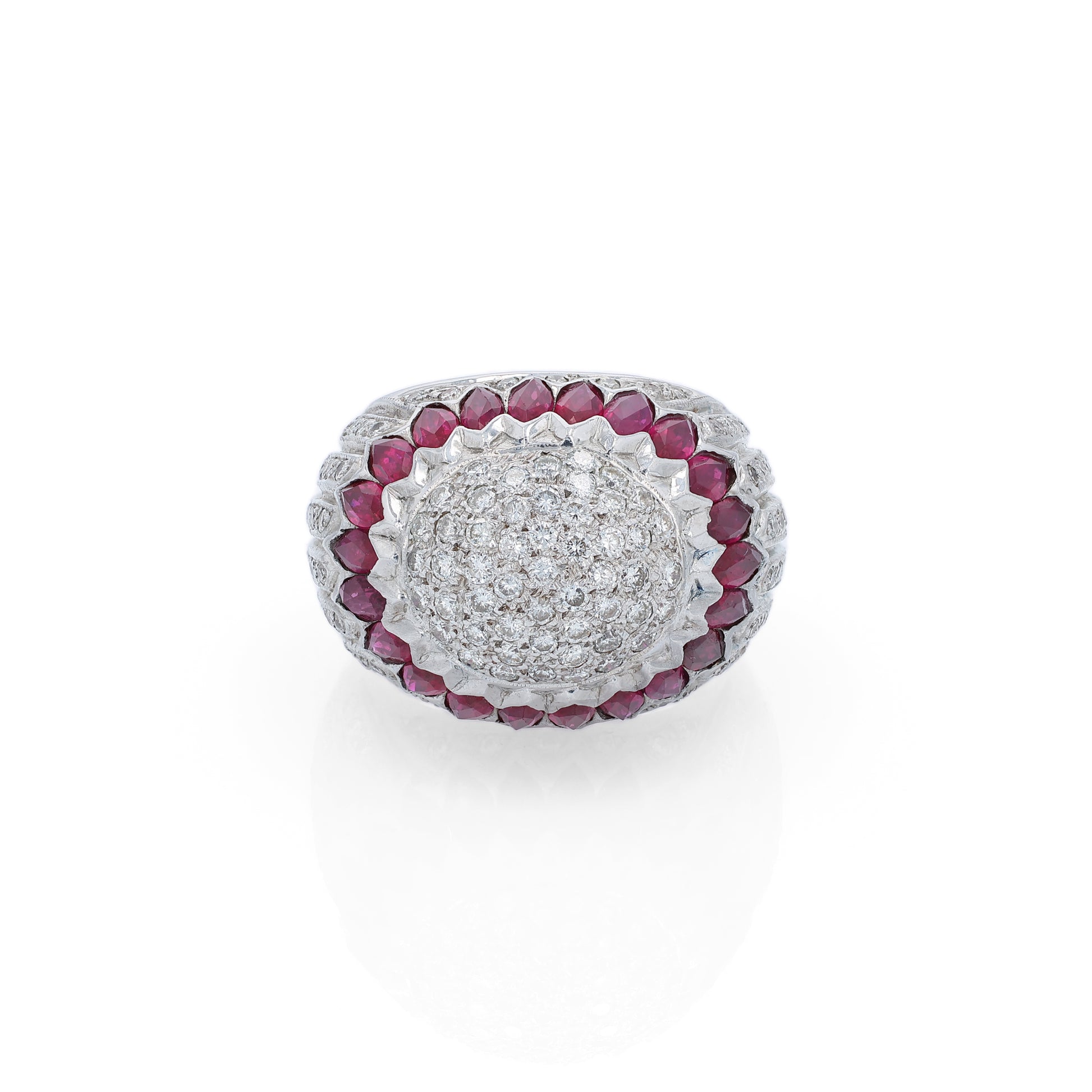 Elegant white gold ring with marquise rubies and diamond accents on a white background