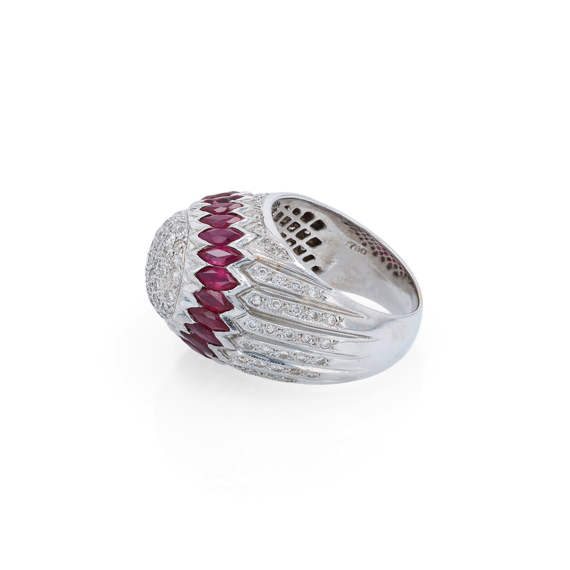 Elegant white gold ring with marquise rubies and diamond accents on a white background