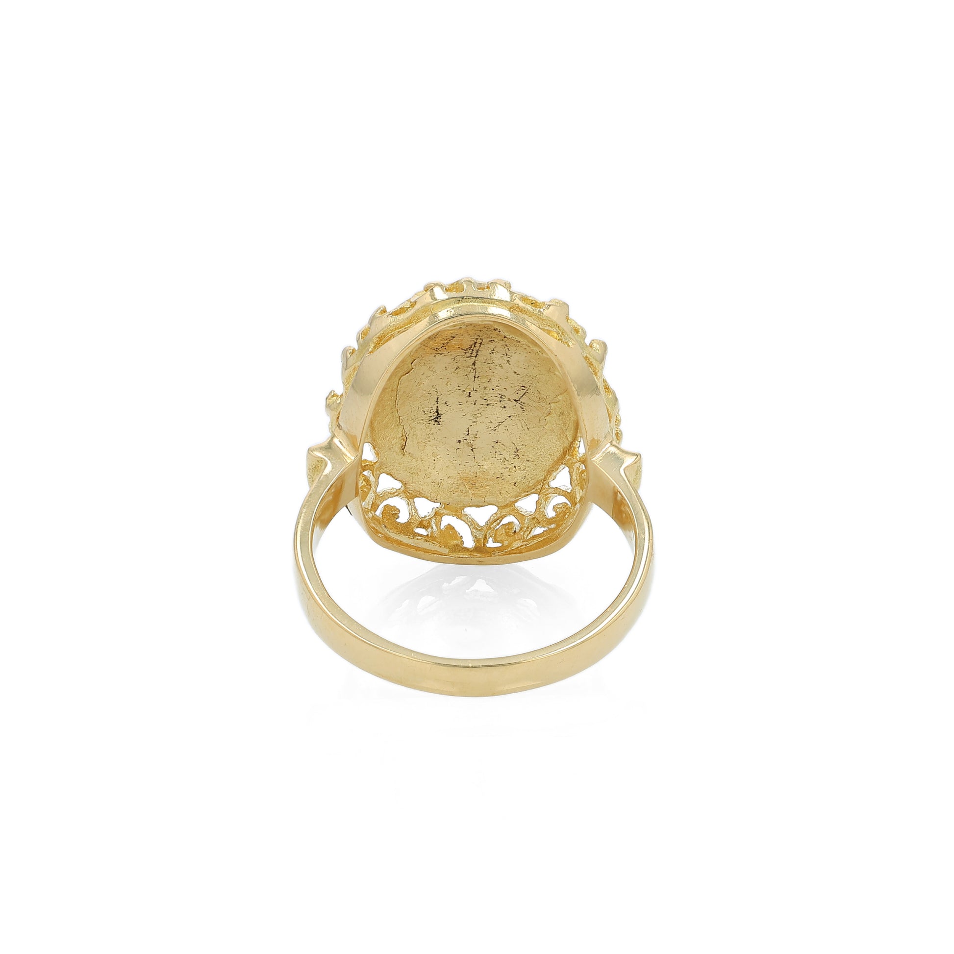 Yellow gold ring with a blue, orange and green flower design enamel center on a white background