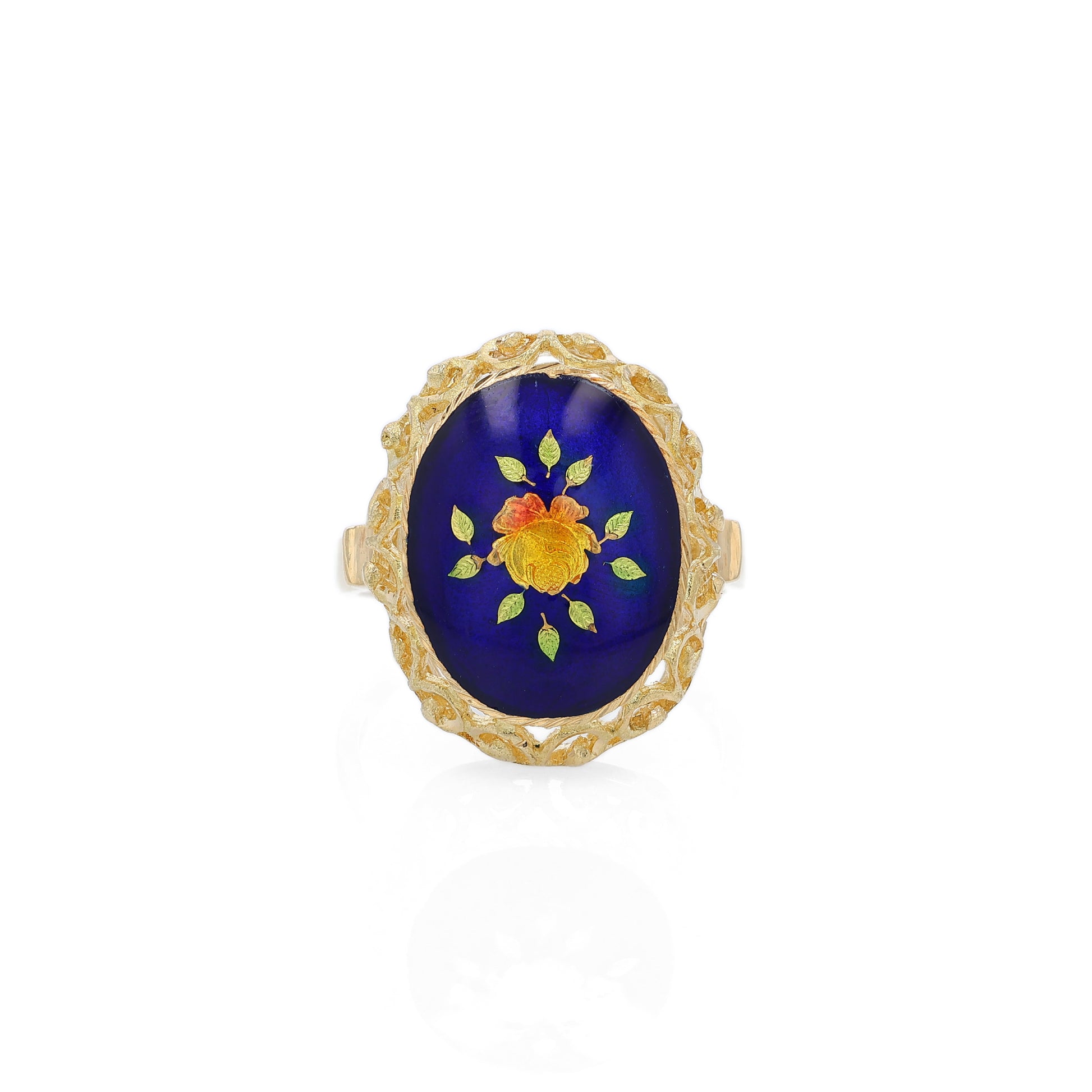 Yellow gold ring with a blue, orange and green flower design enamel center on a white background