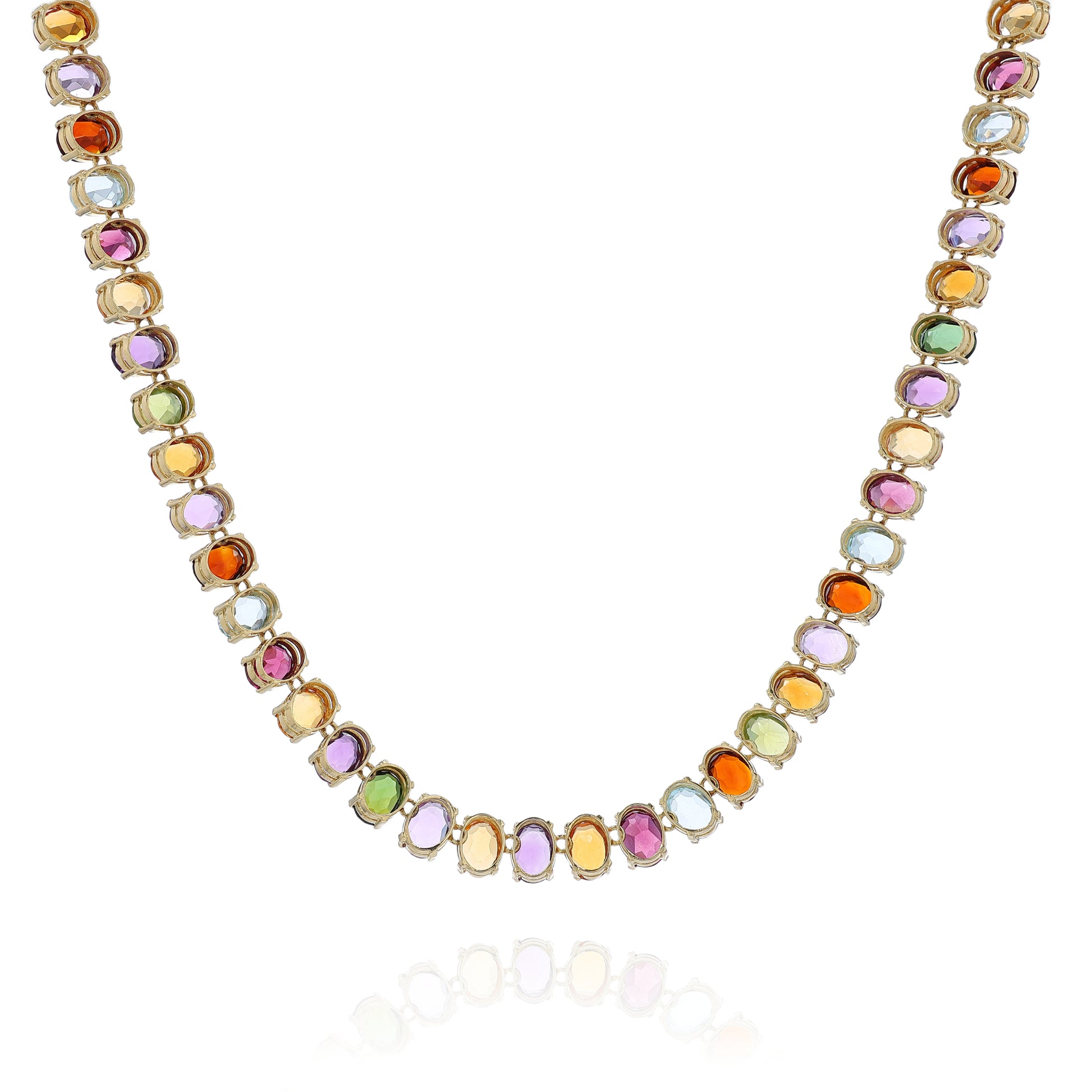 Yellow gold multicolored gemstone necklace on a white background
