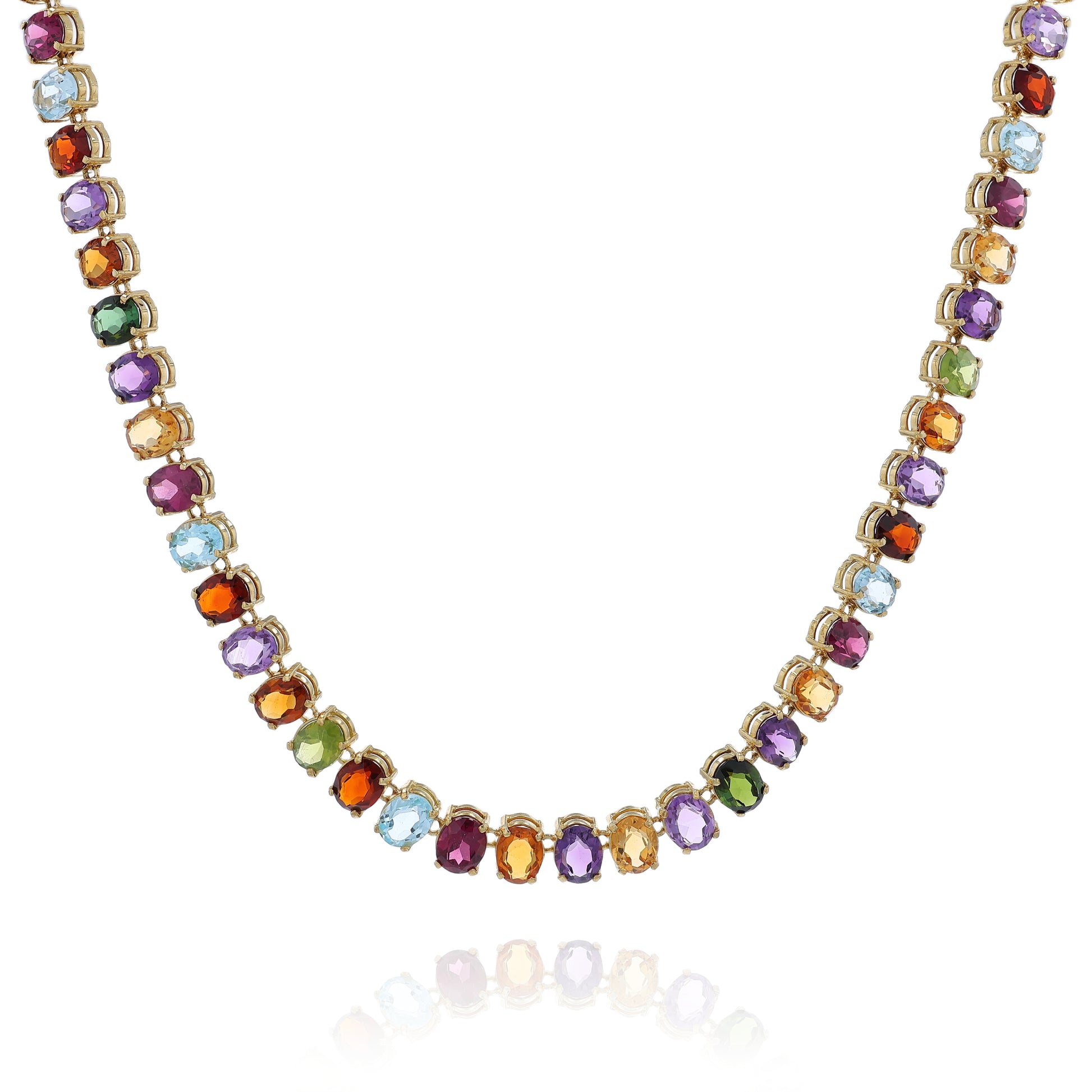 Yellow gold multicolored gemstone necklace on a white background