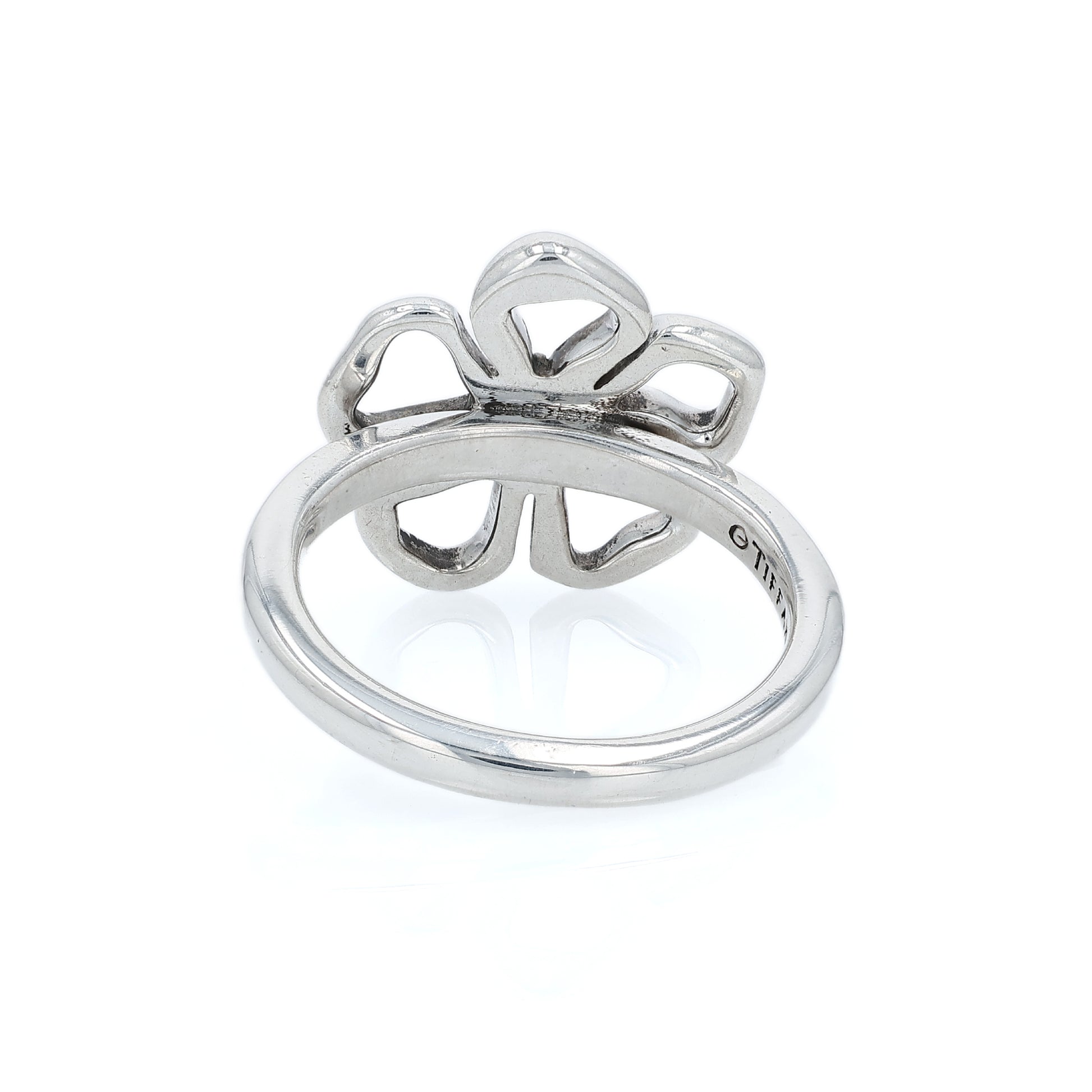 Silver Tiffany & Co open flower design ring on a white background