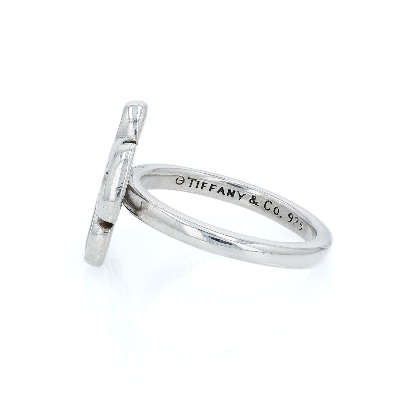 Silver Tiffany & Co open flower design ring on a white background