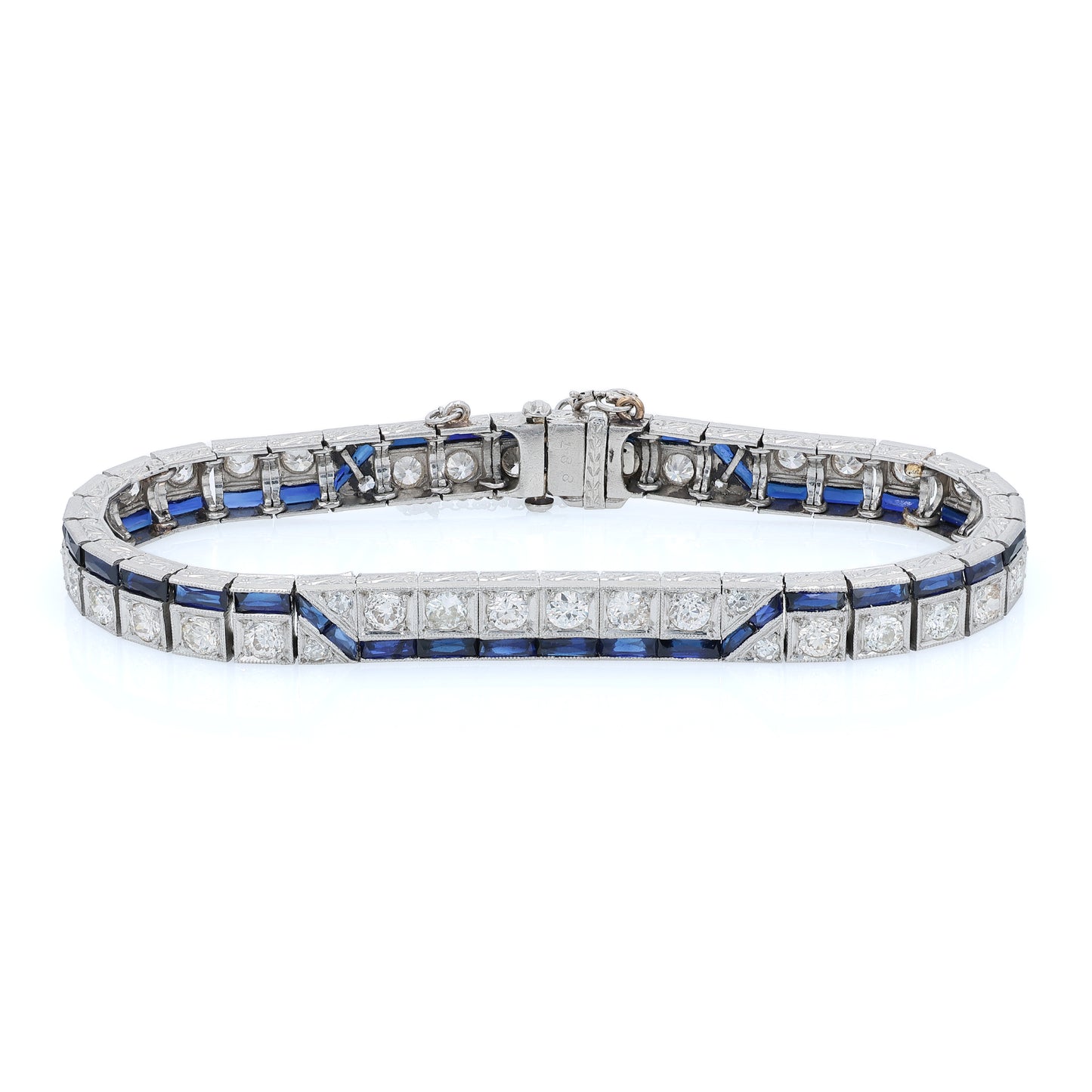 Platinum diamond bracelet with synthetic sapphire accents on a white background