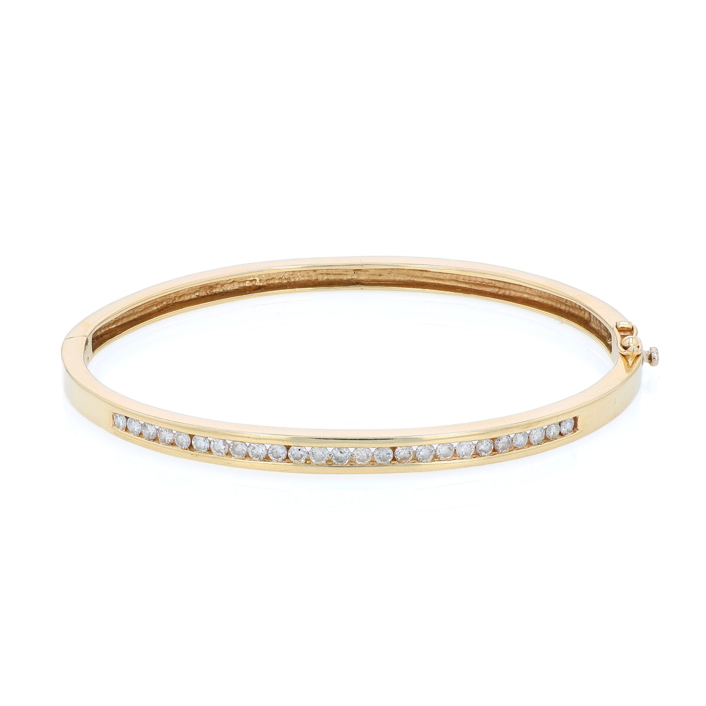 Yellow gold channel set diamond bangle bracelet on a white background