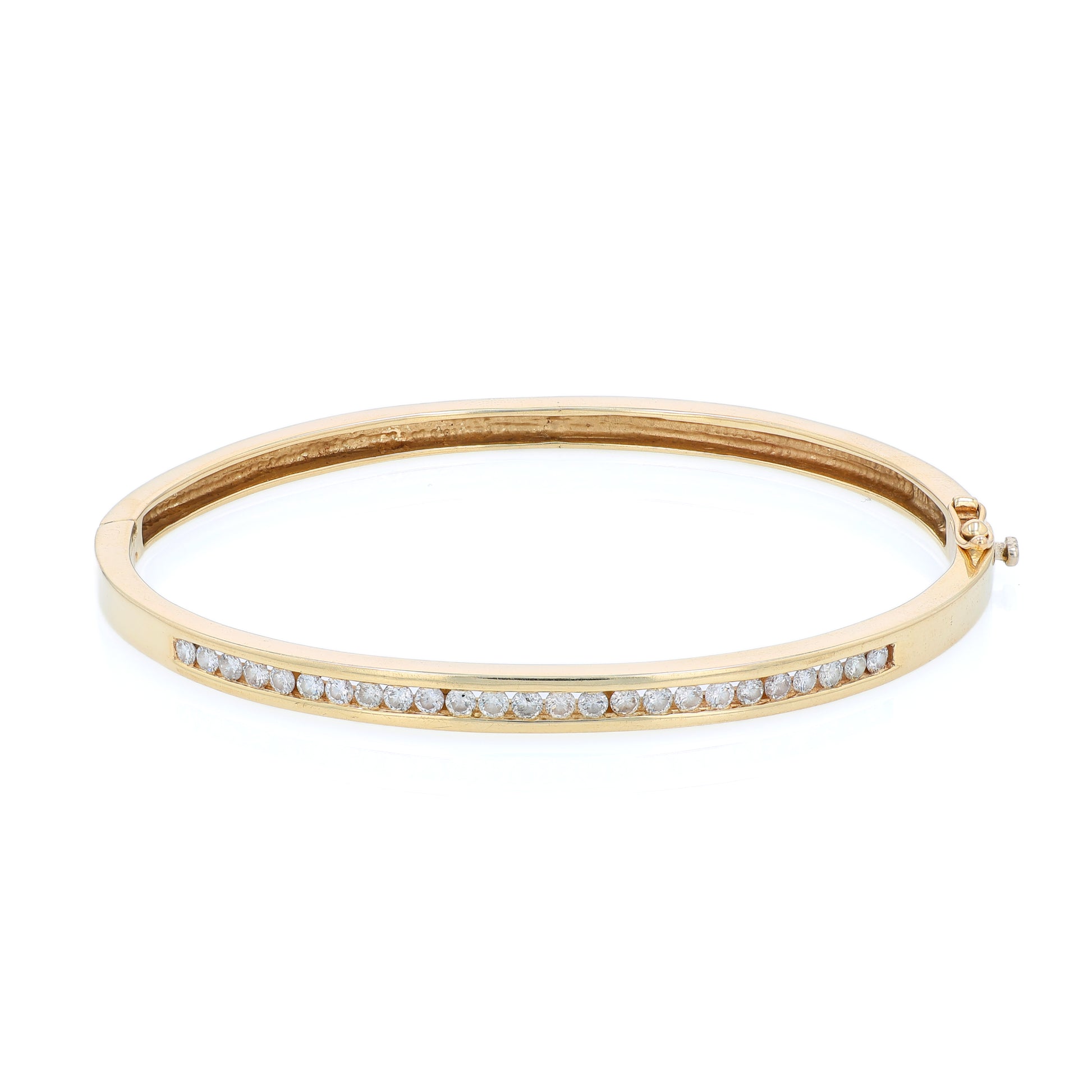 Yellow gold channel set diamond bangle bracelet on a white background