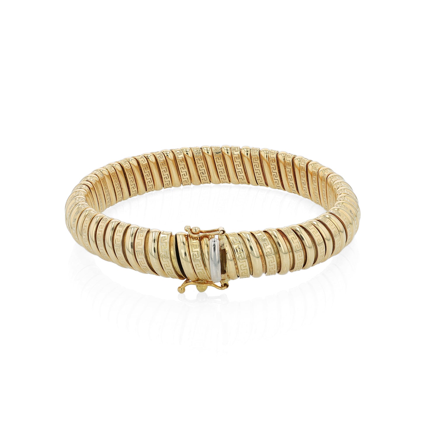Yellow gold alternating polished and greek key design soft tubogas bangle bracelet on a white background