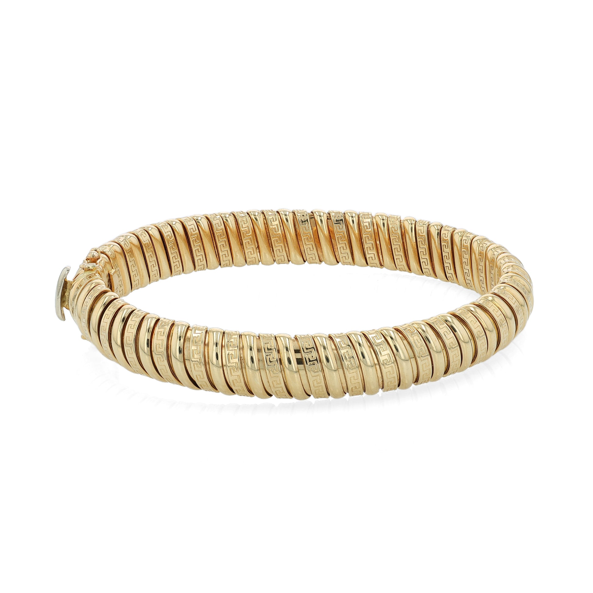 Yellow gold alternating polished and greek key design soft tubogas bangle bracelet on a white background