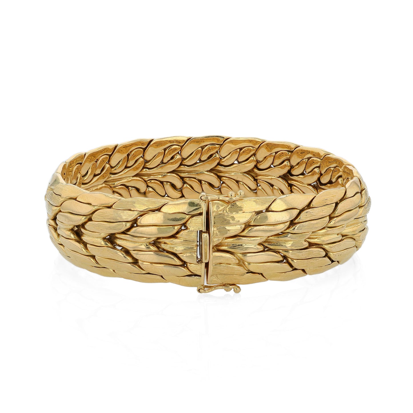 Brushed and polished yellow gold bracelet on a white background