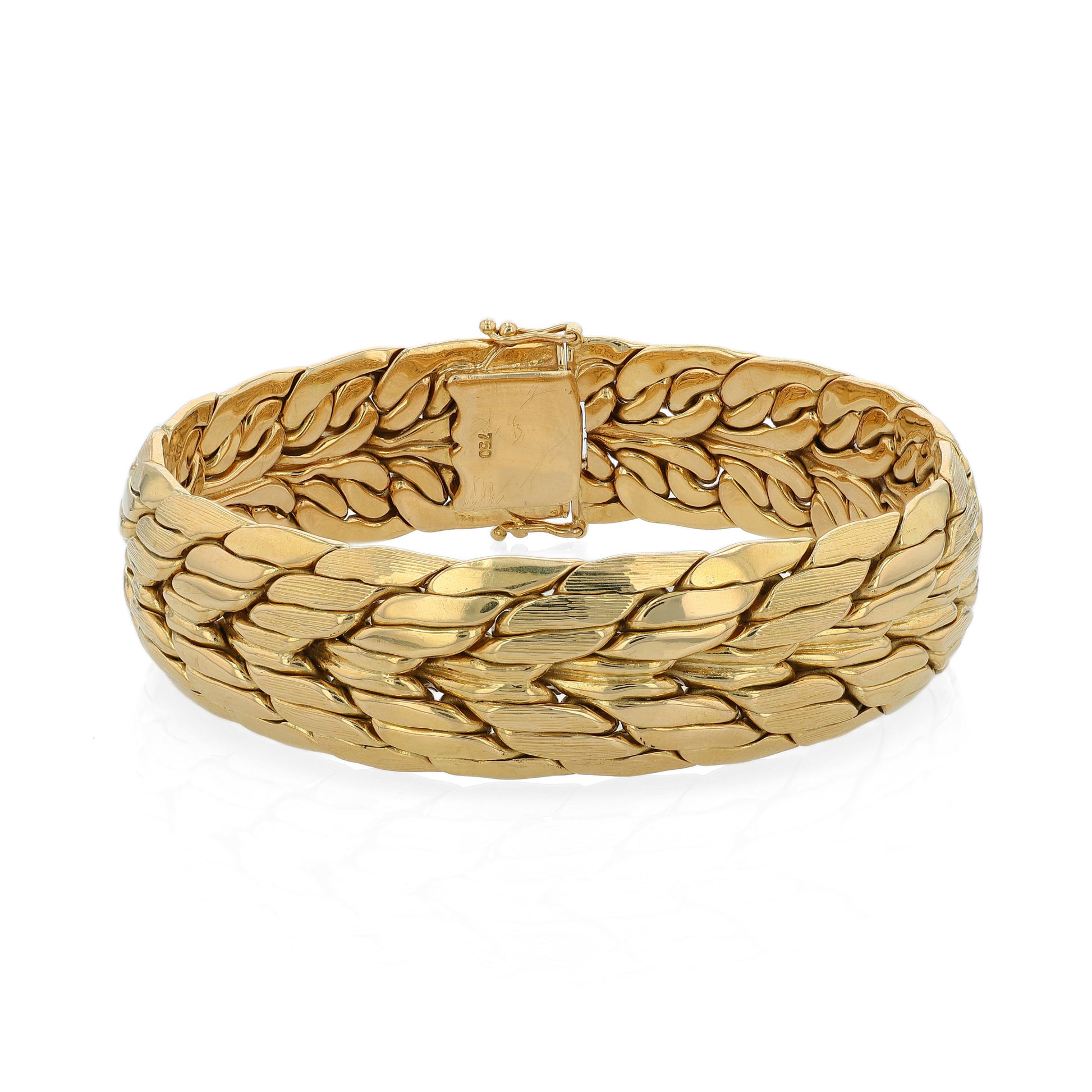 Brushed and polished yellow gold bracelet on a white background