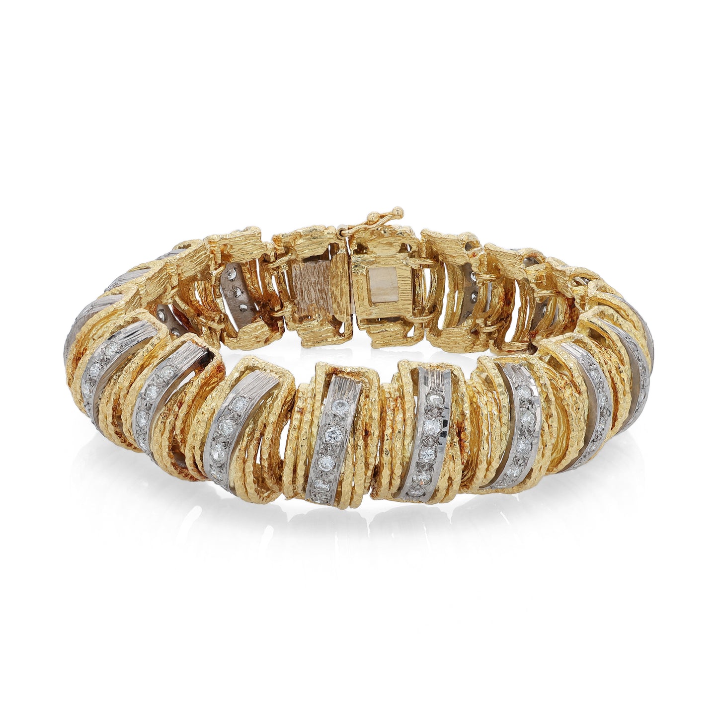 Textured two-tone gold bracelet with diamonds on a white background