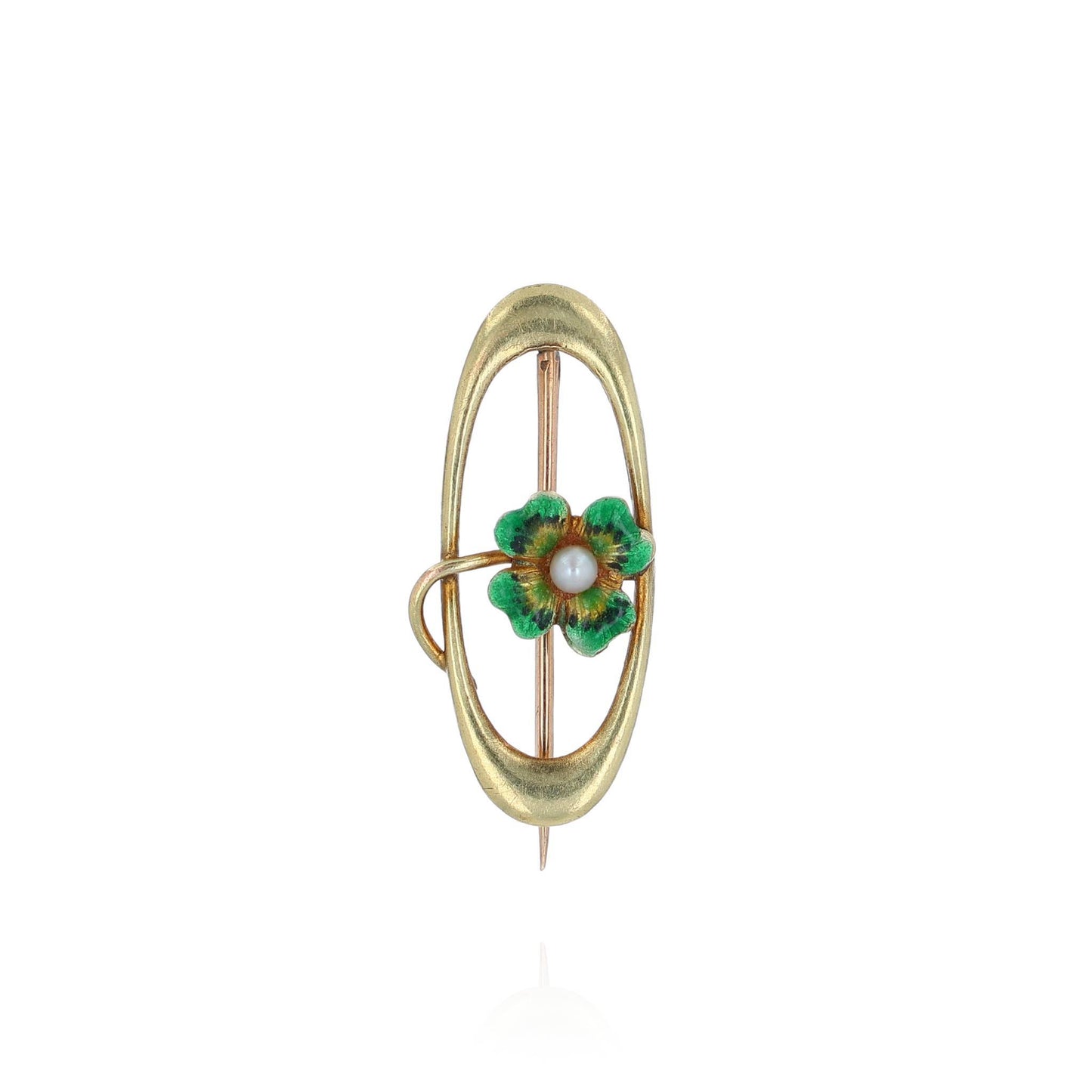 A yellow gold open oval pin with a green enamel four leaf clover and a seed pearl on a white background