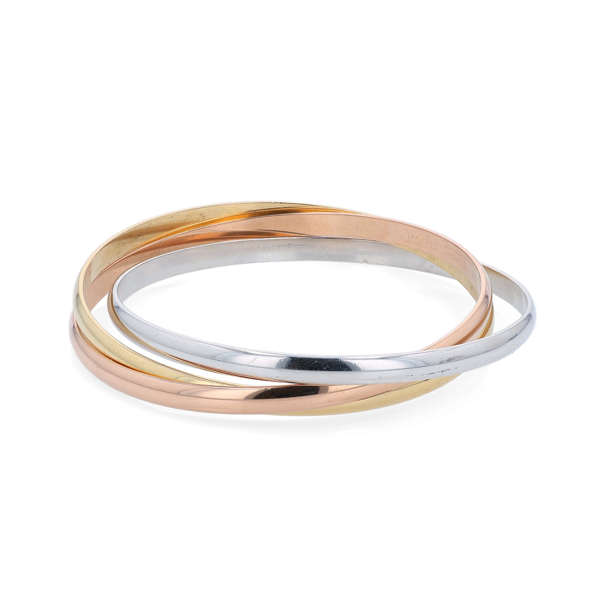 Tri-tone gold Cartier branded triple ring slip on bangle bracelet on a white background