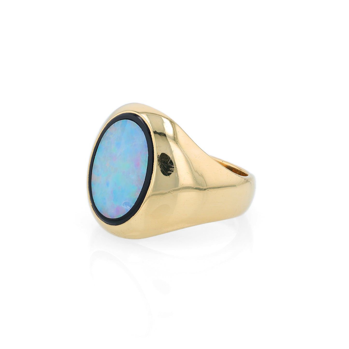 Yellow Gold oval opal doublet signet style ring on a white background