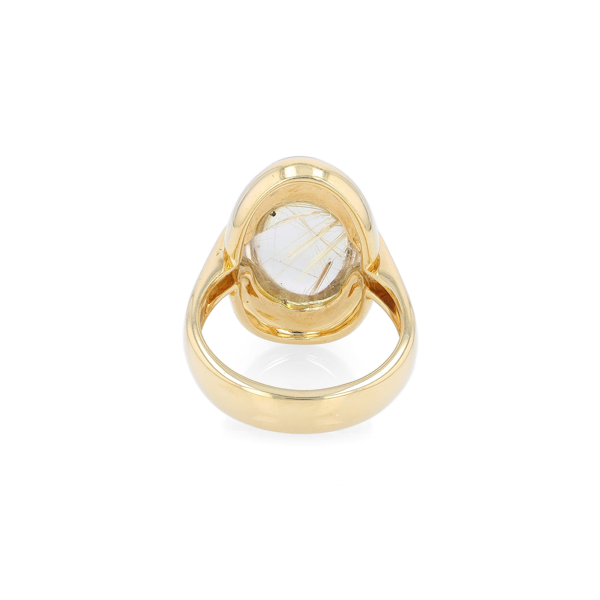 Yellow gold oval cabochon rutilated quartz ring on a white background