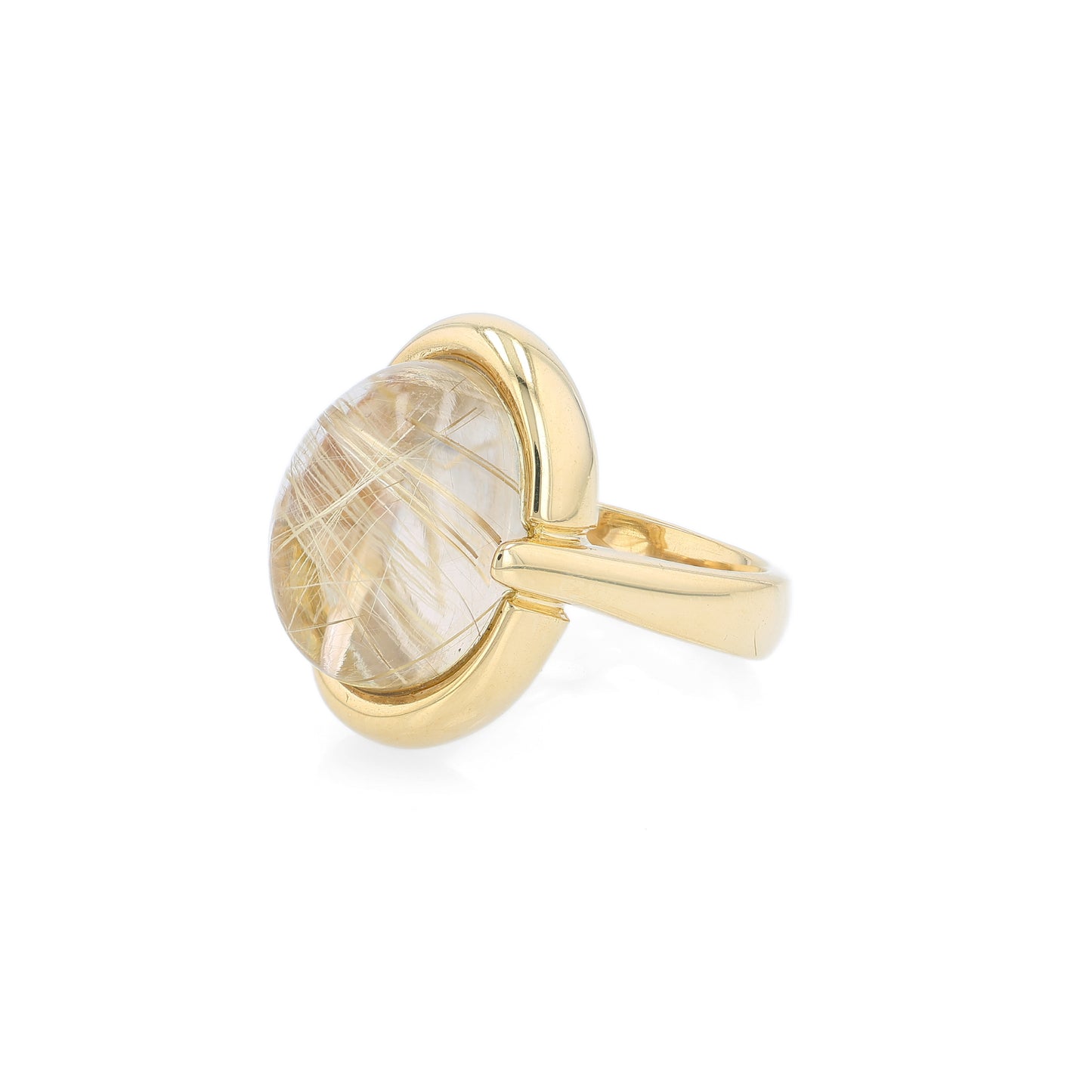 Yellow gold oval cabochon rutilated quartz ring on a white background