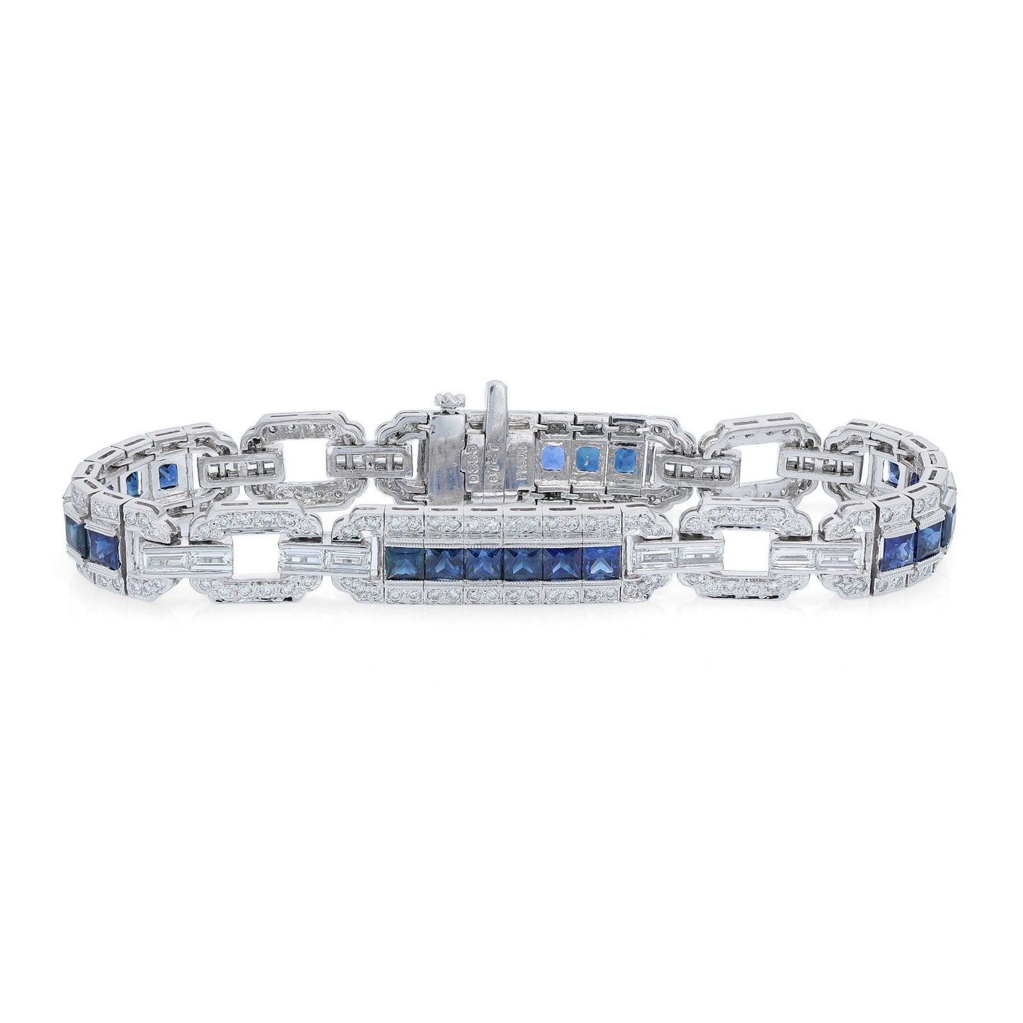 Platinum alternating synthetic sapphire and diamond link bracelet on a white background