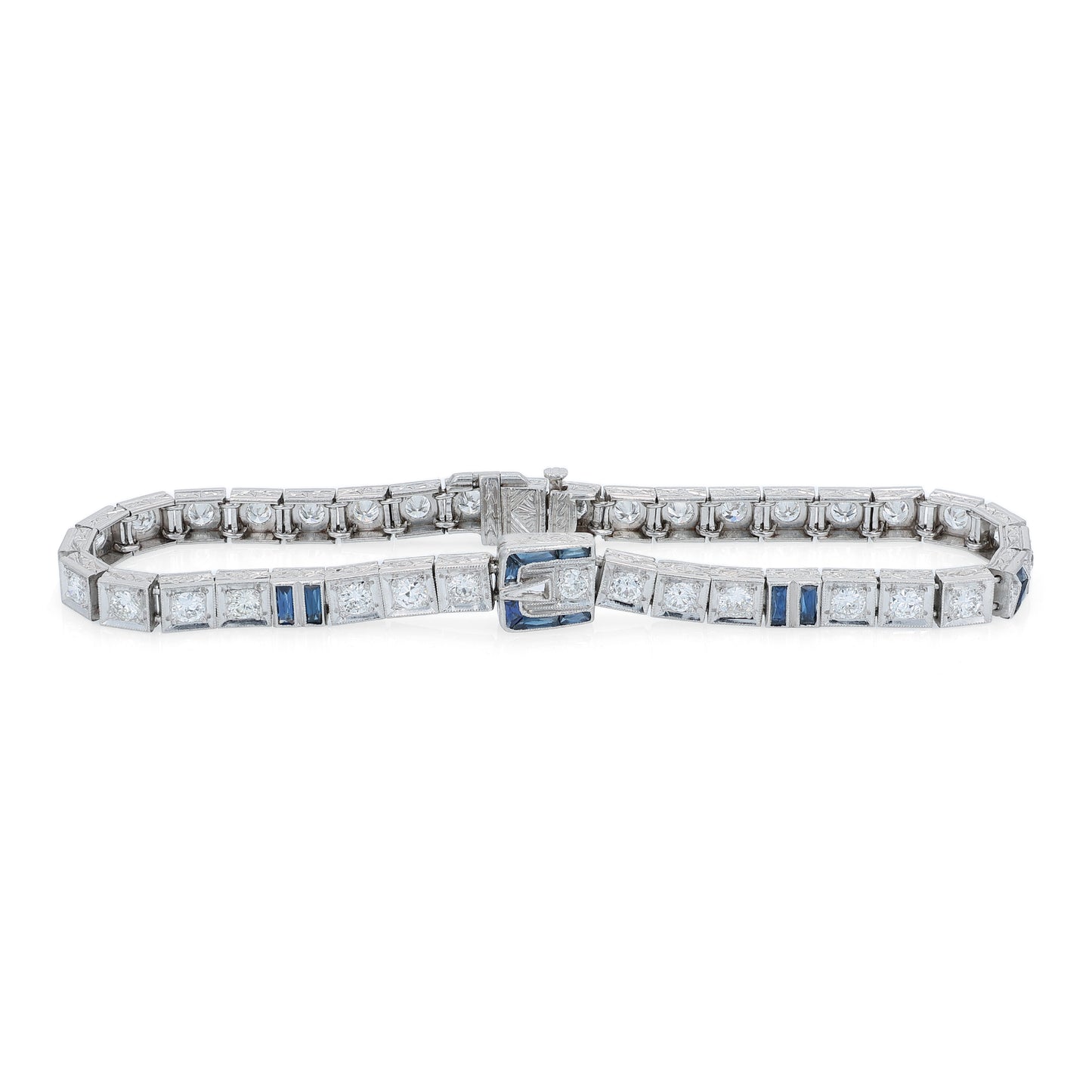 Platinum buckle design diamond and synthetic sapphire tennis bracelet on a white background